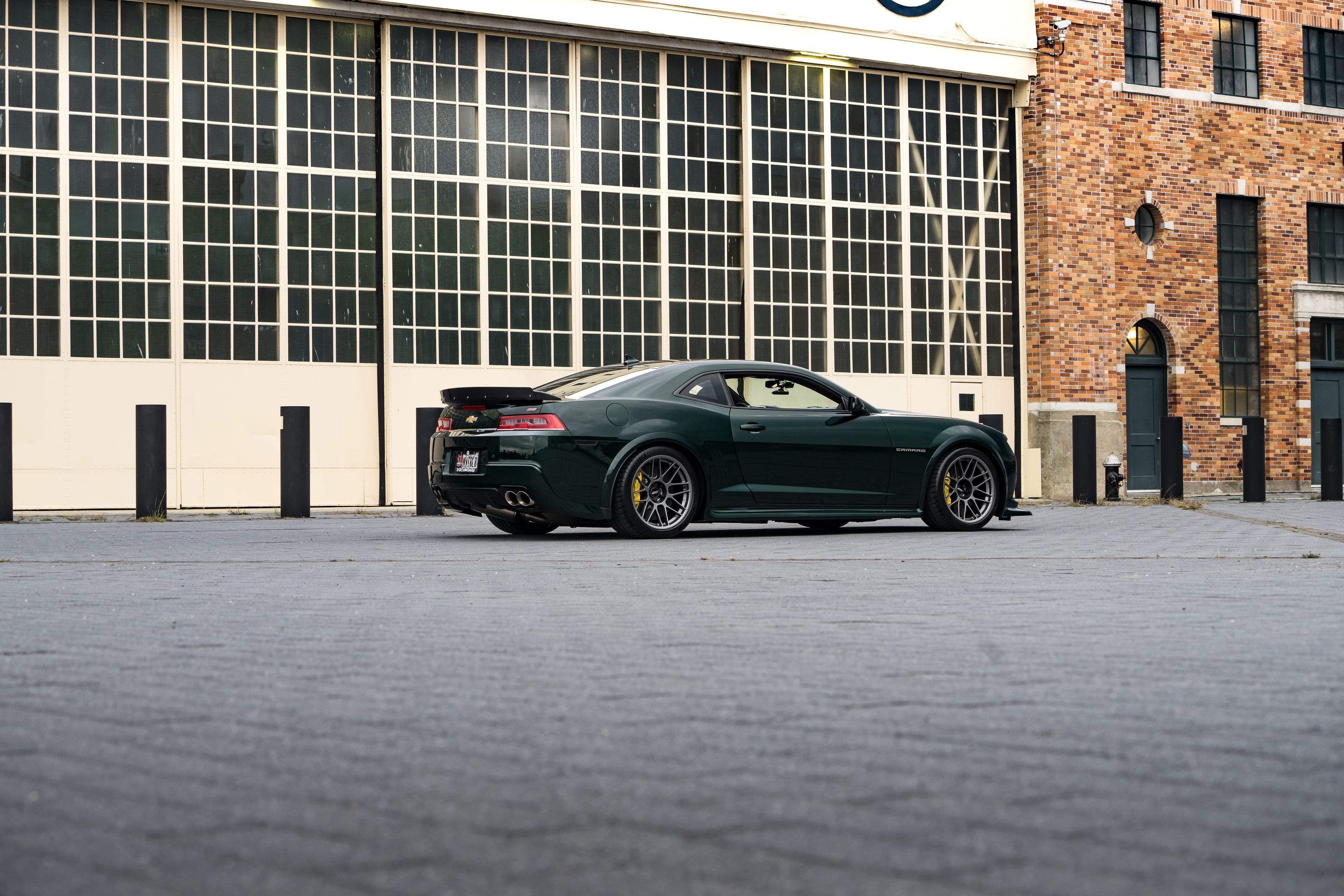 Green Chevrolet 5th Gen Camaro SS with 19" ARC-8 Apex wheels in Anthracite