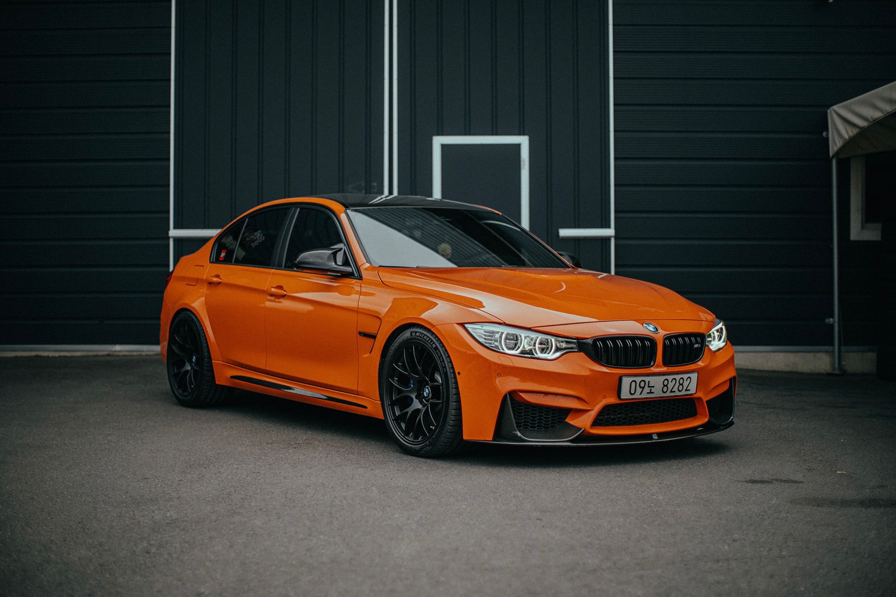 Orange BMW F80 M3 with 18" EC-7 Apex wheels in Satin Black
