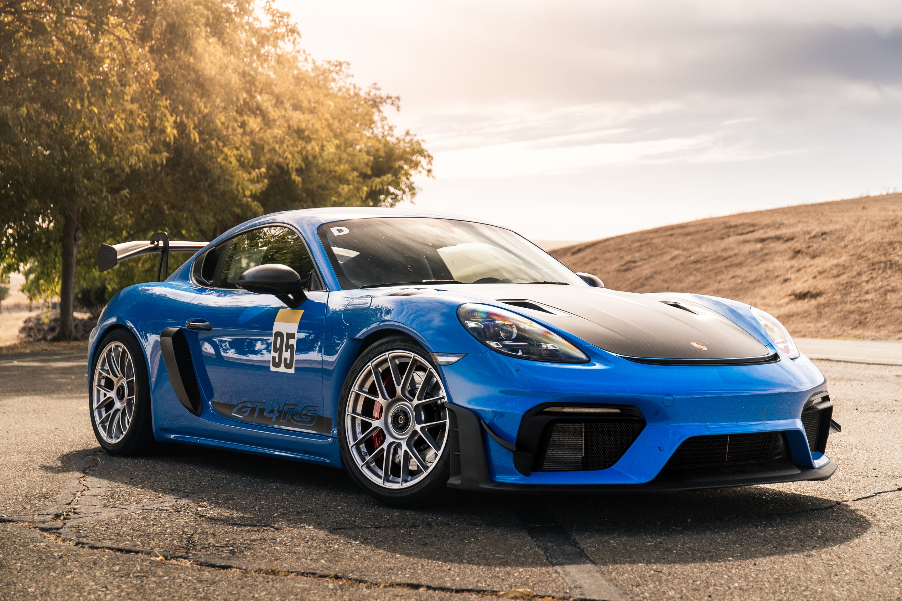 Blue Porsche 718 Cayman GT4 RS with 19" EC-7RS Apex wheels in Race Silver