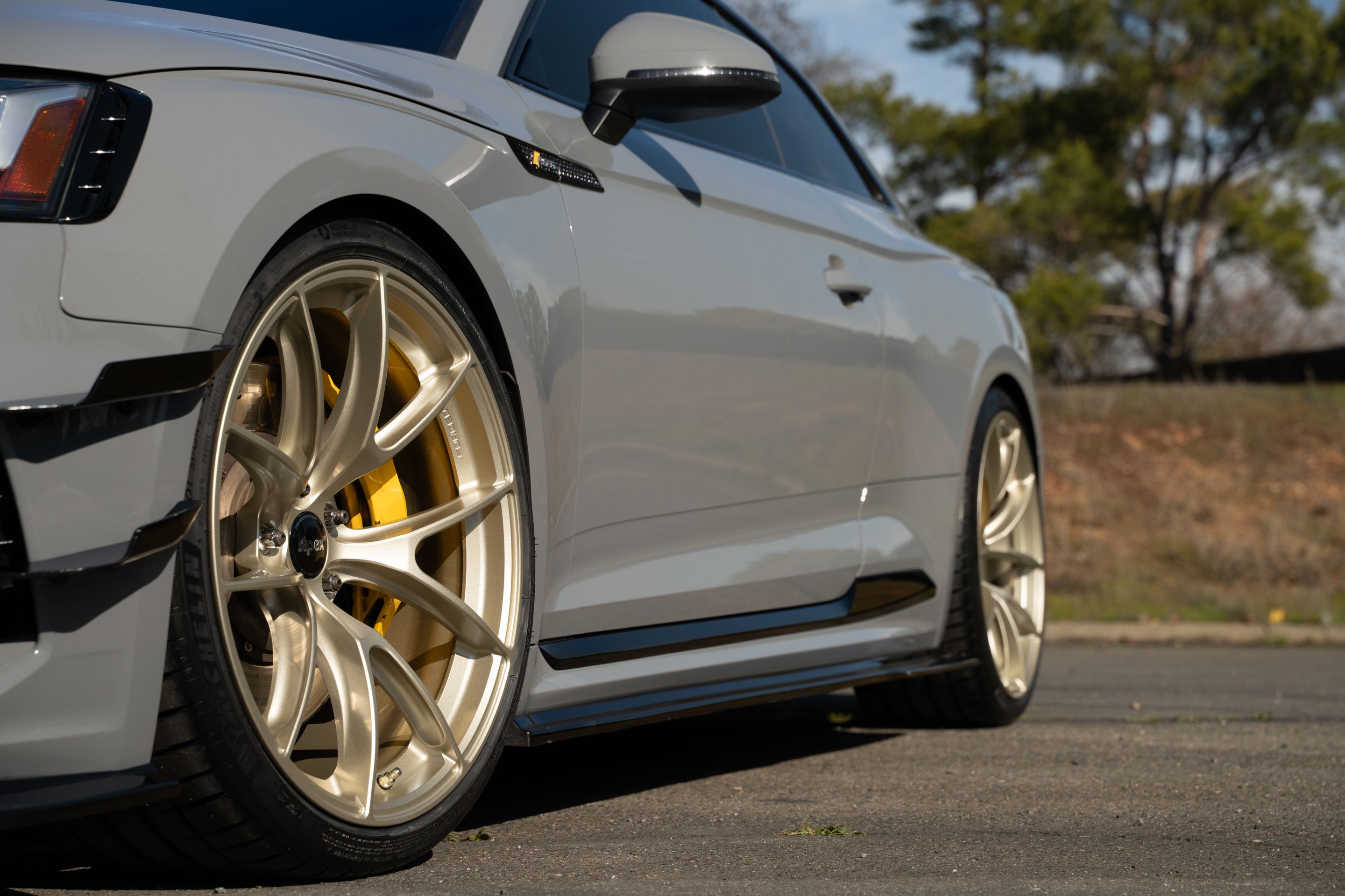 Grey Audi B9 RS 5 Coupe with 20" VS-5RS Apex wheels in Motorsport Gold