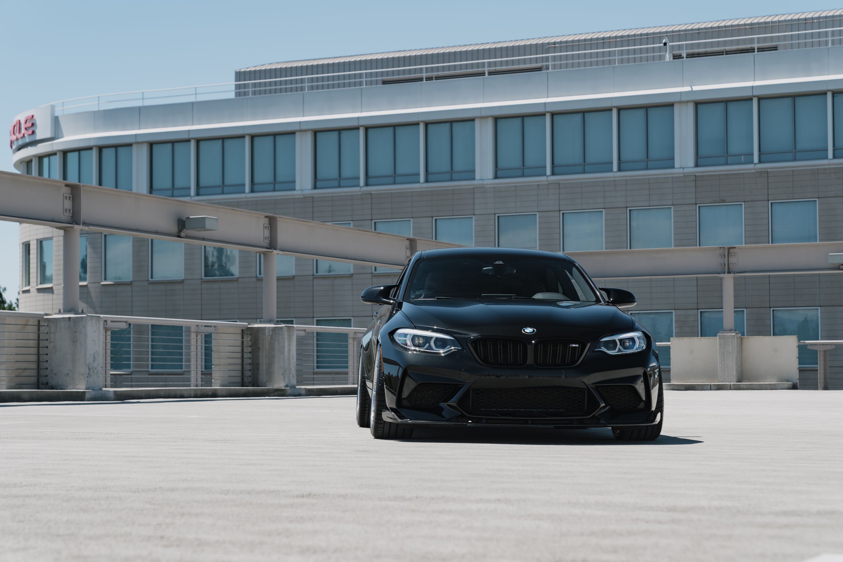 Black BMW F87 M2 with 19" ARC-8RT Apex wheels in Brushed Clear