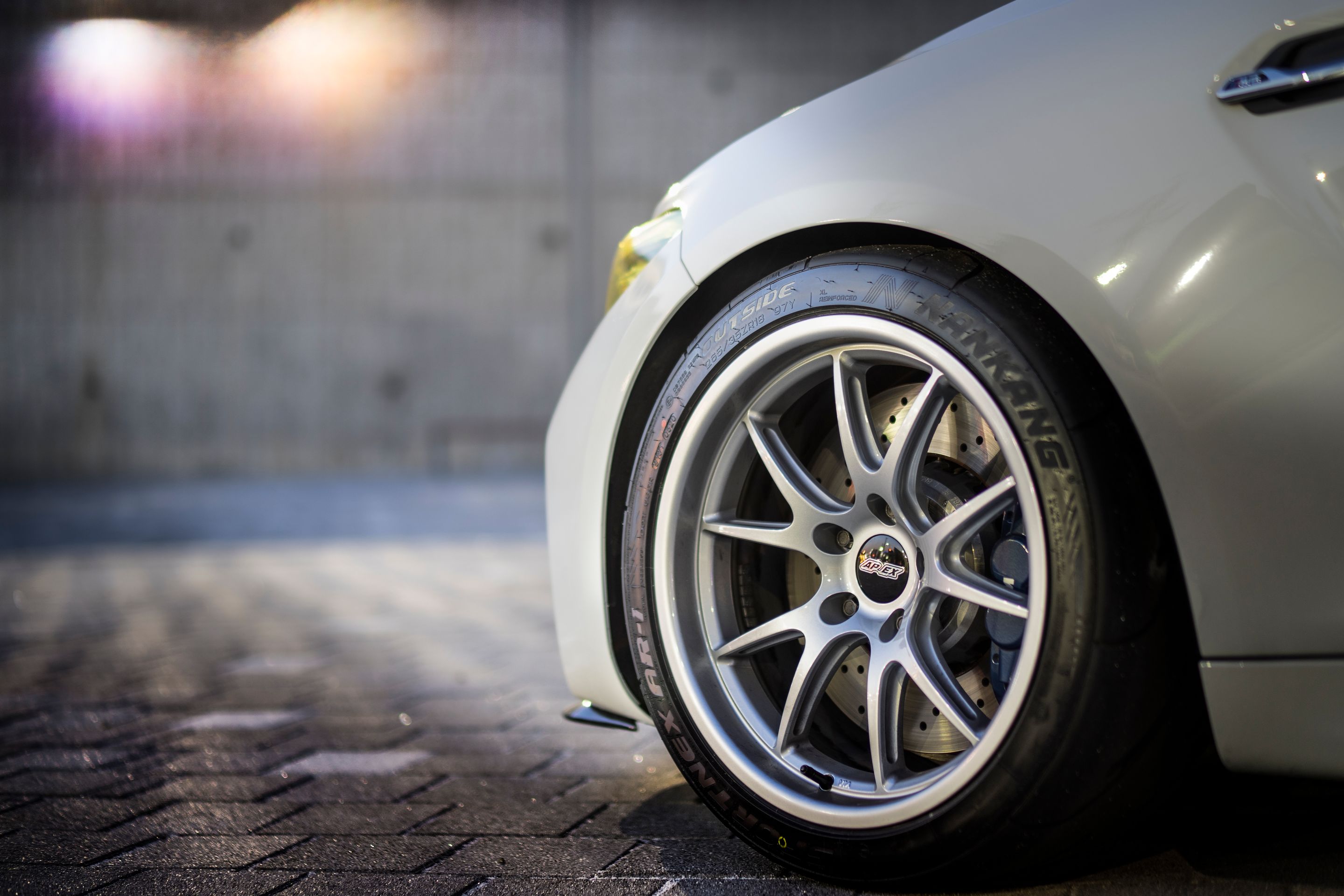 White BMW F87 M2 with 18" FL-5 Apex wheels in Race Silver