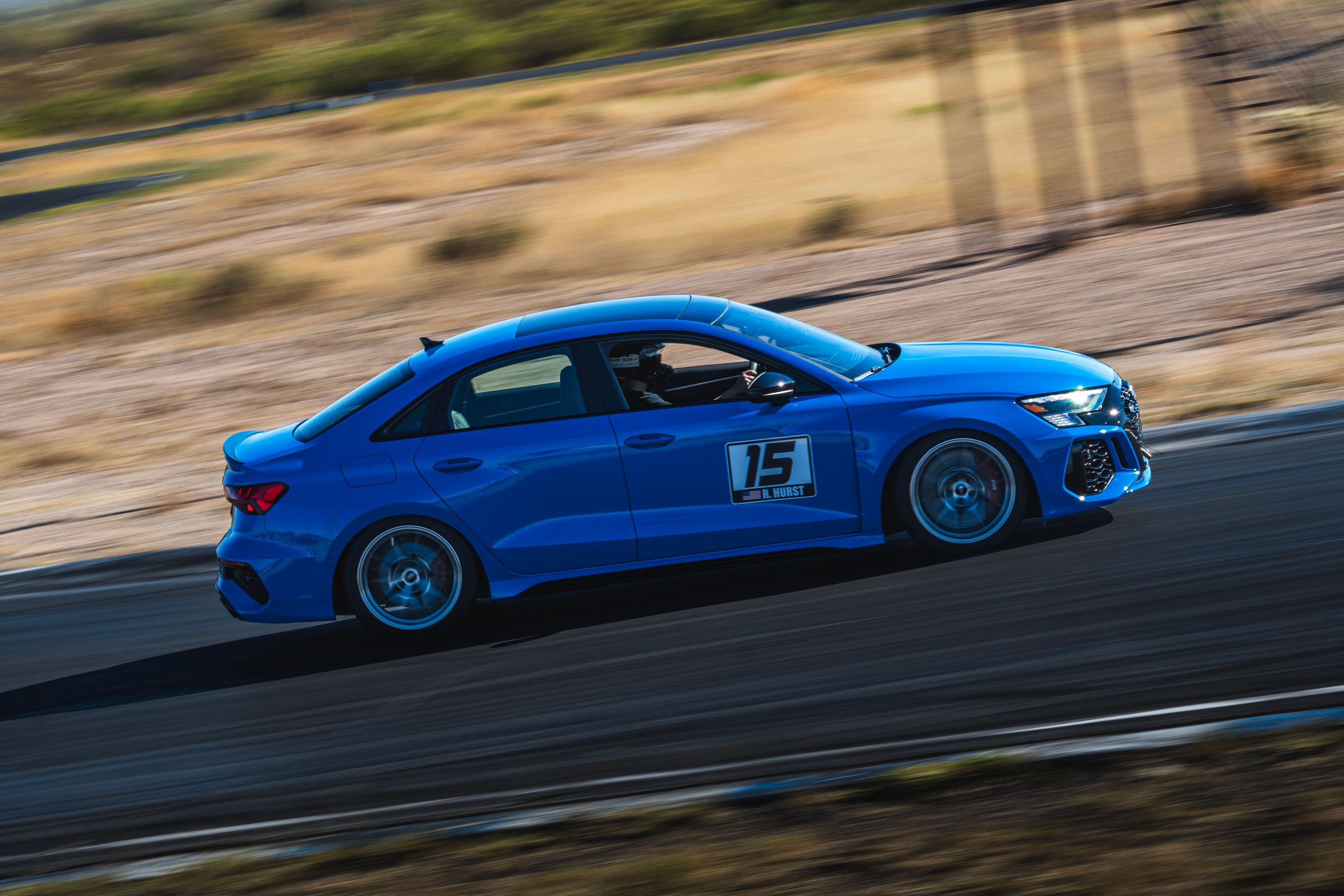 Blue Audi 8Y RS 3 with 18" VS-5RS Apex wheels in Brushed Clear