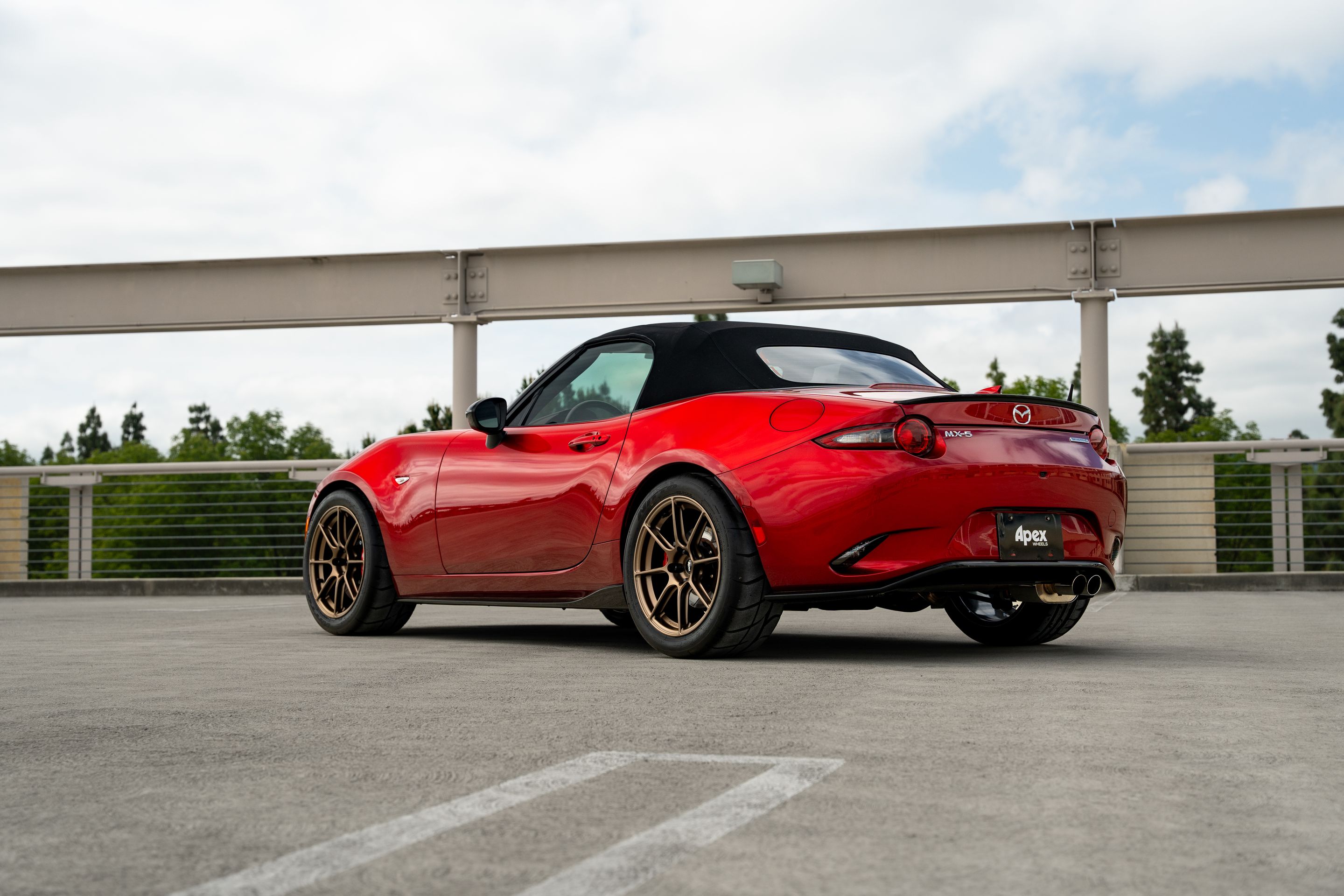 Red Mazda ND MX-5 Miata with 17" SM-8RS Apex wheels in Satin Bronze
