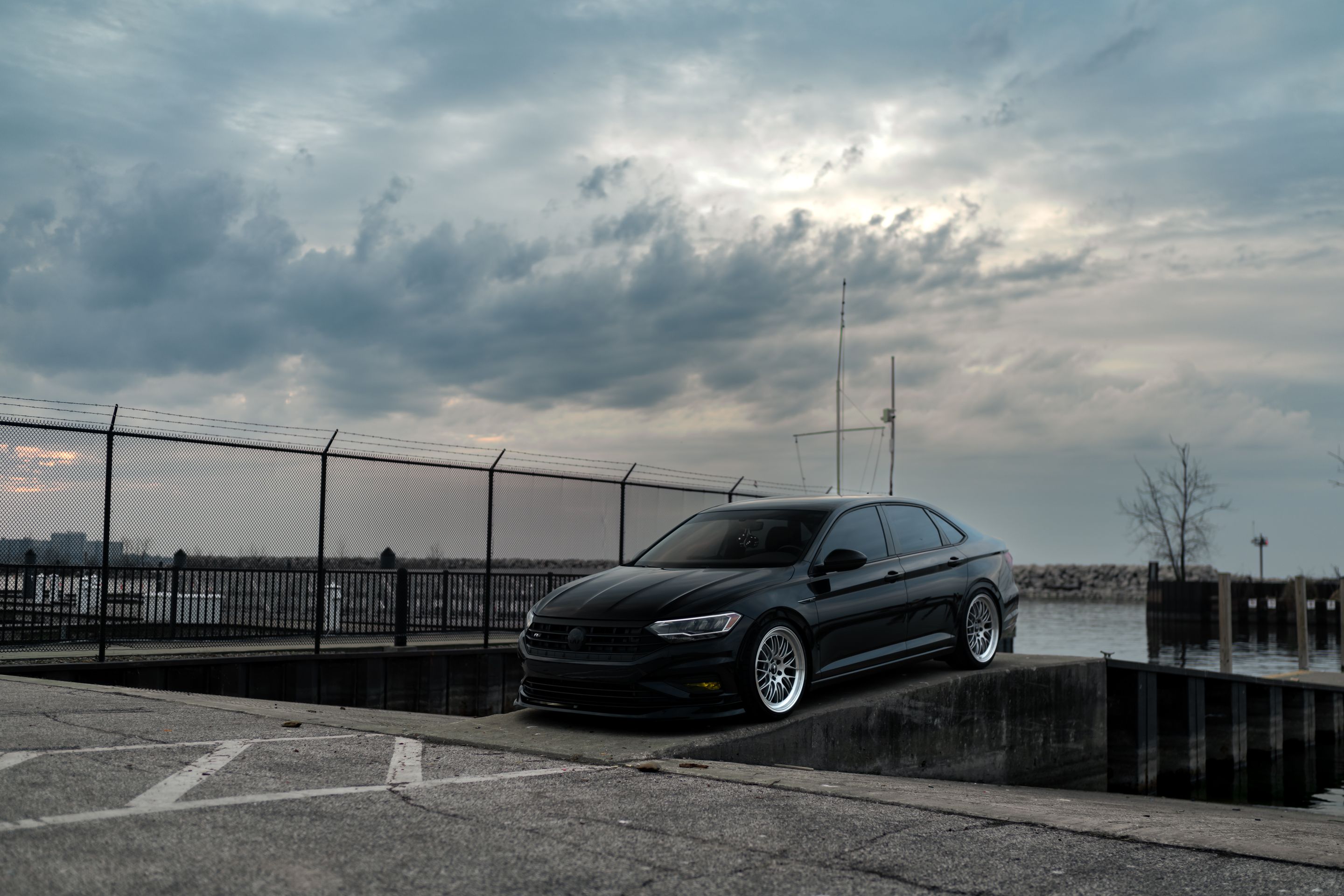 Black VW MK7 Jetta with 19" ML-10RT Apex wheels in Machined Lip Race Silver