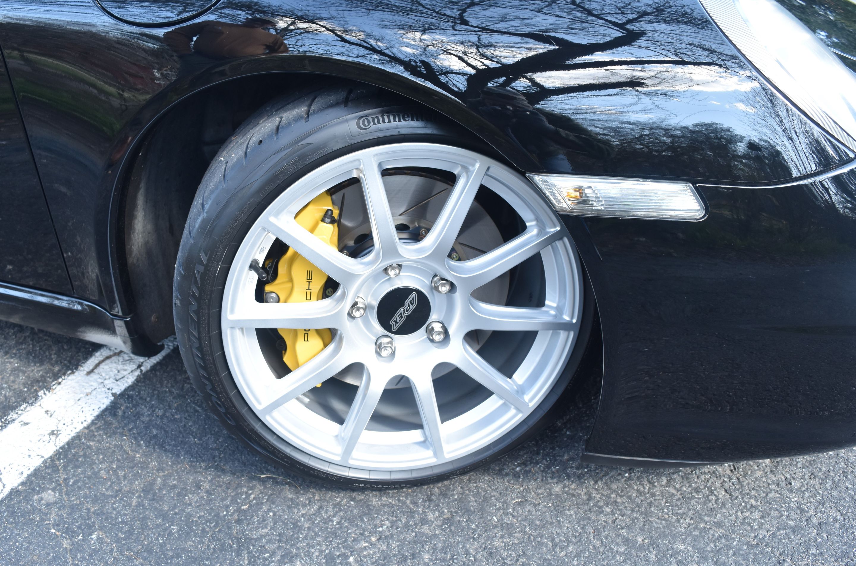 Black Porsche 911 997 Carrera S with 18" SM-10 Apex wheels in Race Silver
