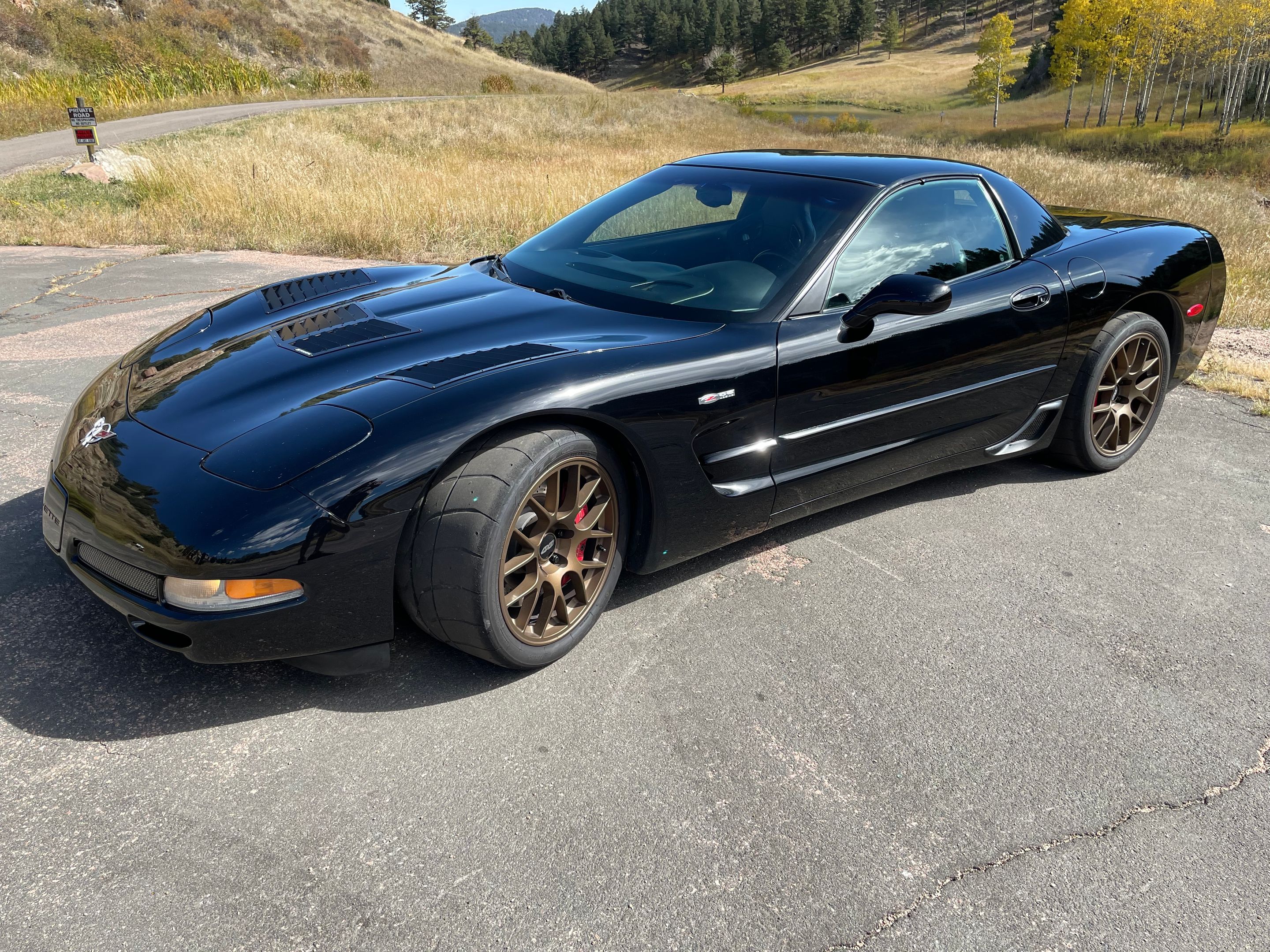 Black Chevrolet C5 Corvette Z06 with 18" EC-7 Apex wheels in Satin Bronze