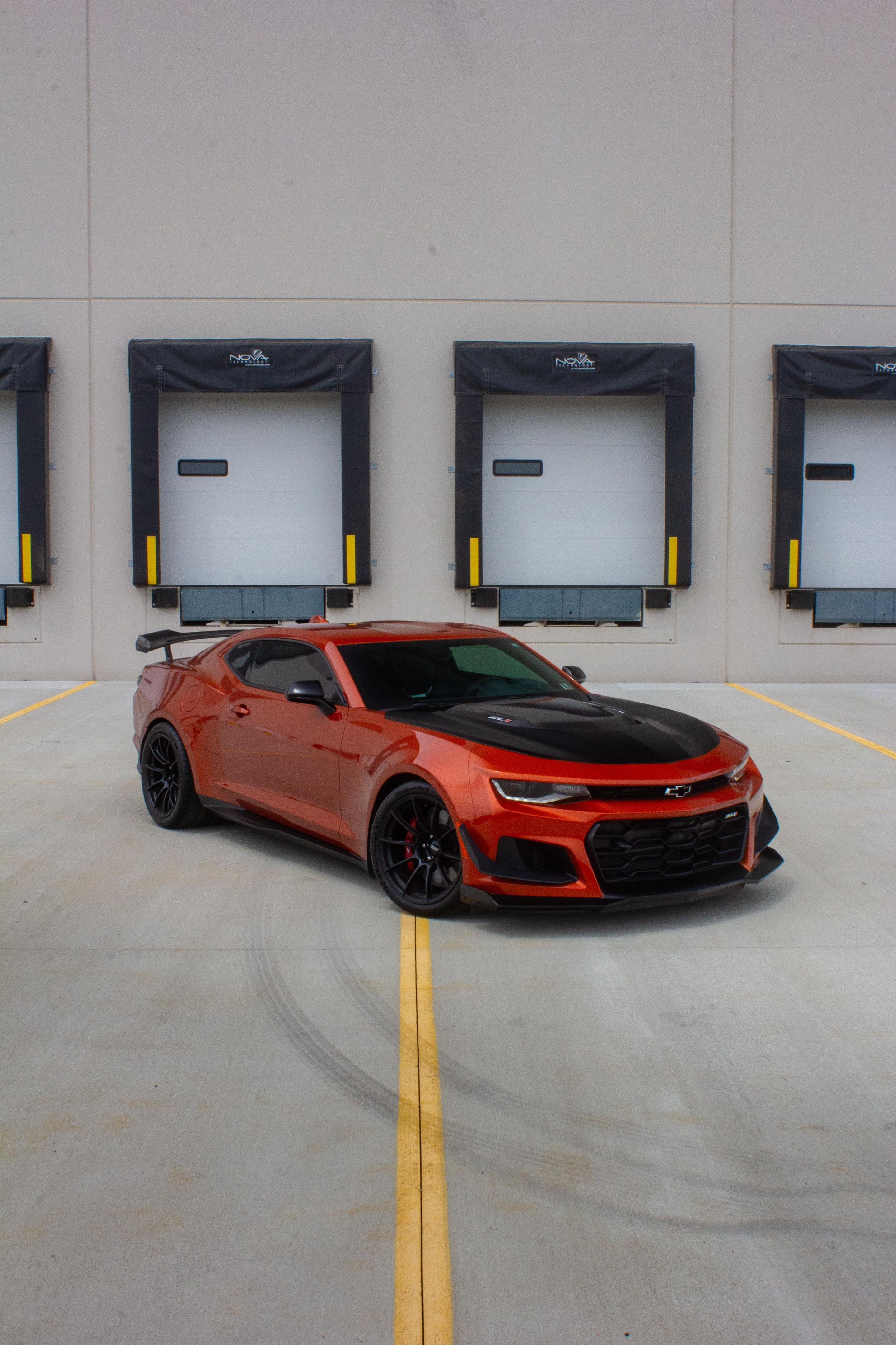 Red Chevrolet 6th Gen Camaro ZL1 1LE with 19" SM-10RS Apex wheels in Satin Black
