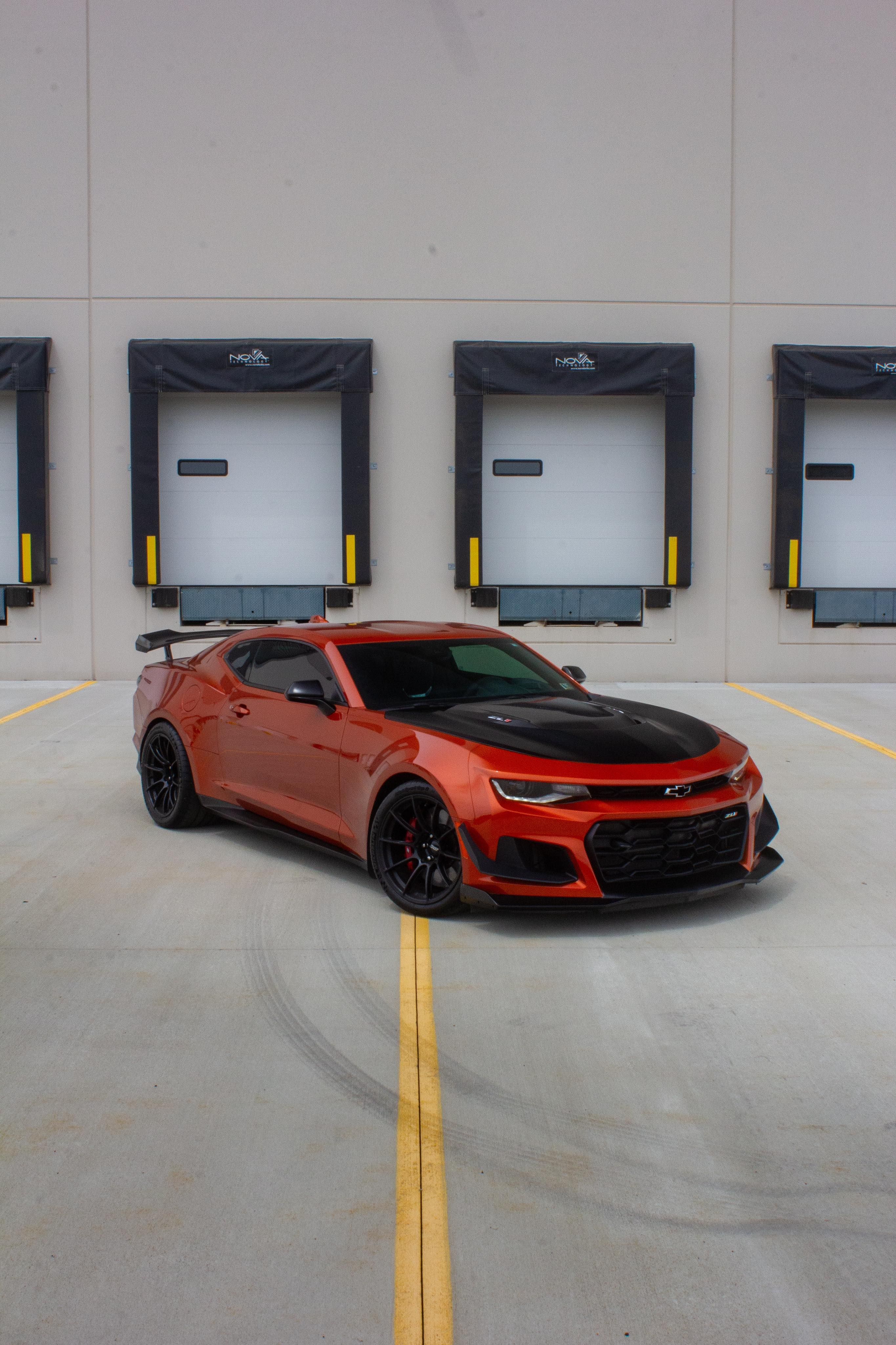 Red Chevrolet 6th Gen Camaro ZL1 1LE with 19" SM-10RS Apex wheels in Satin Black