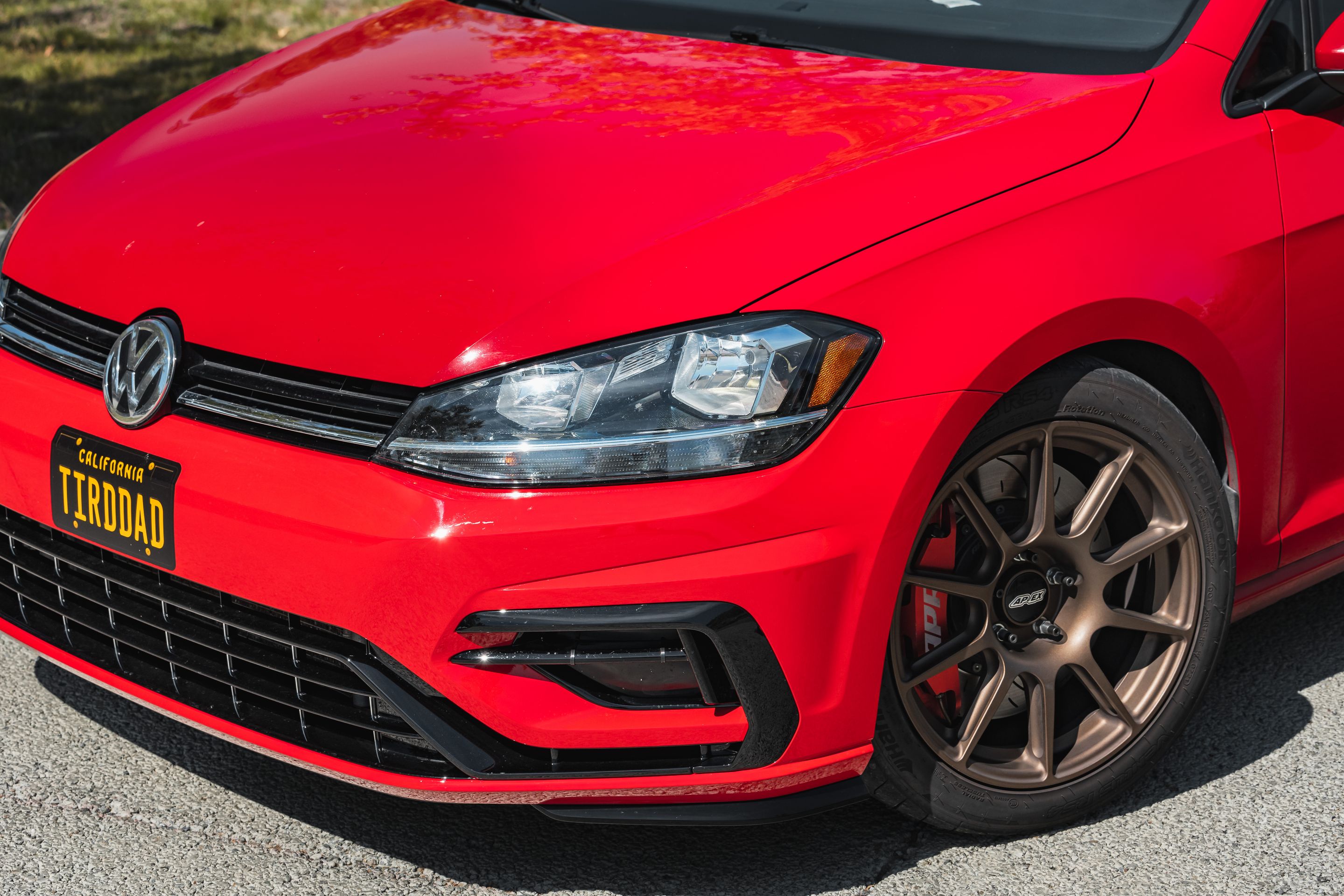 Red VW MK7 Alltrack/SportWagen Golf SportWagen with 17" SM-10 Apex wheels in Satin Bronze