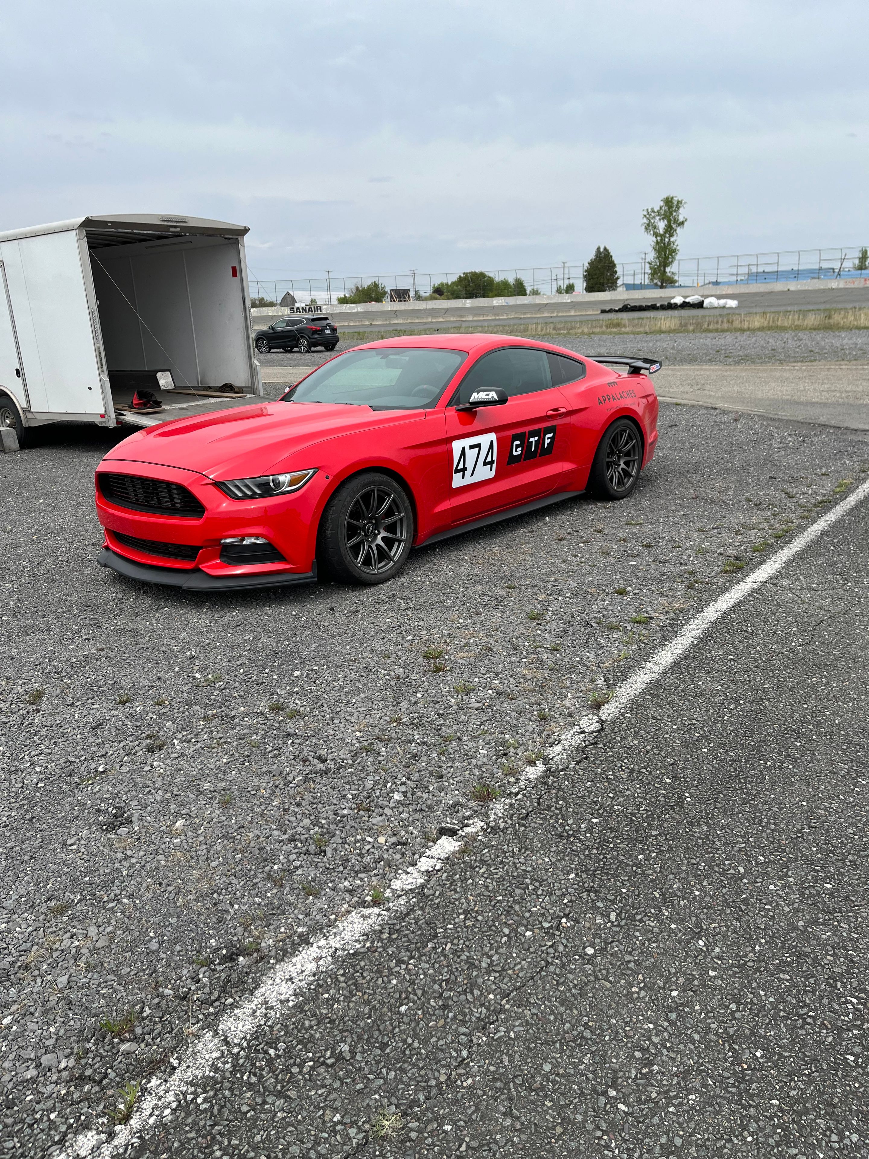 Red Ford S550 Mustang GT with 18" SM-10 Apex wheels in Anthracite