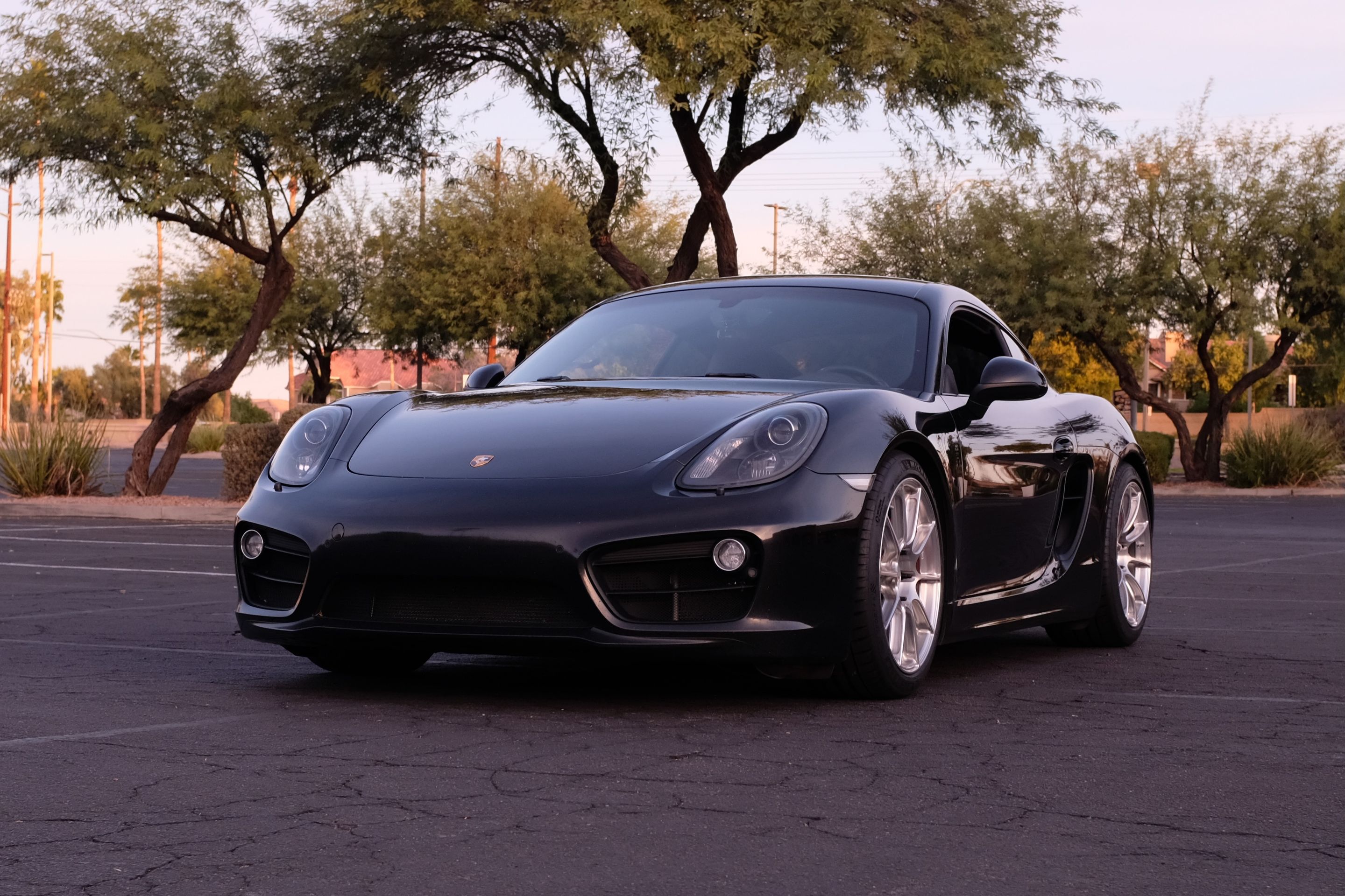Black Porsche 981 Cayman S with 19" SM-10RS Apex wheels in Brushed Clear