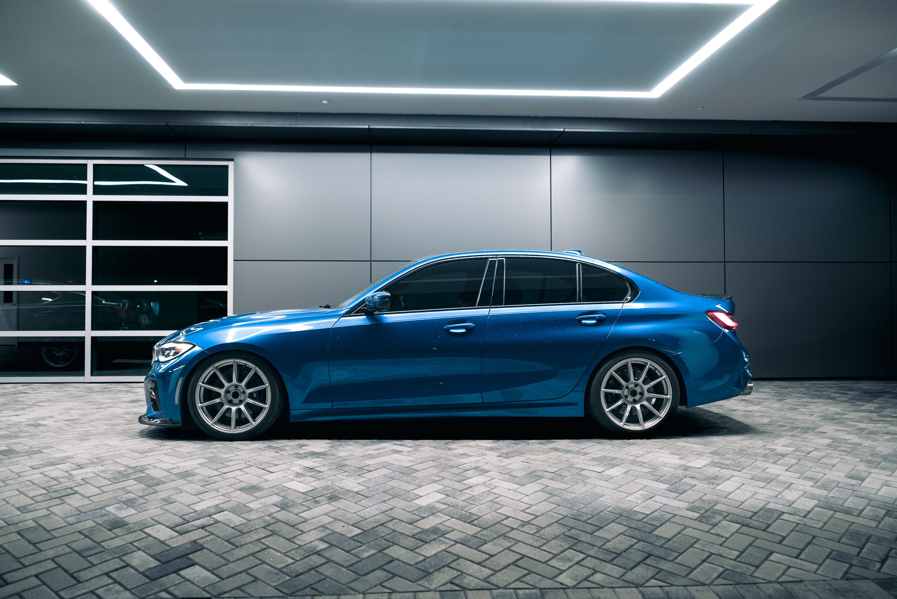 Blue BMW G20 Sedan 3 Series with 19" SM-10 Apex wheels in Race Silver