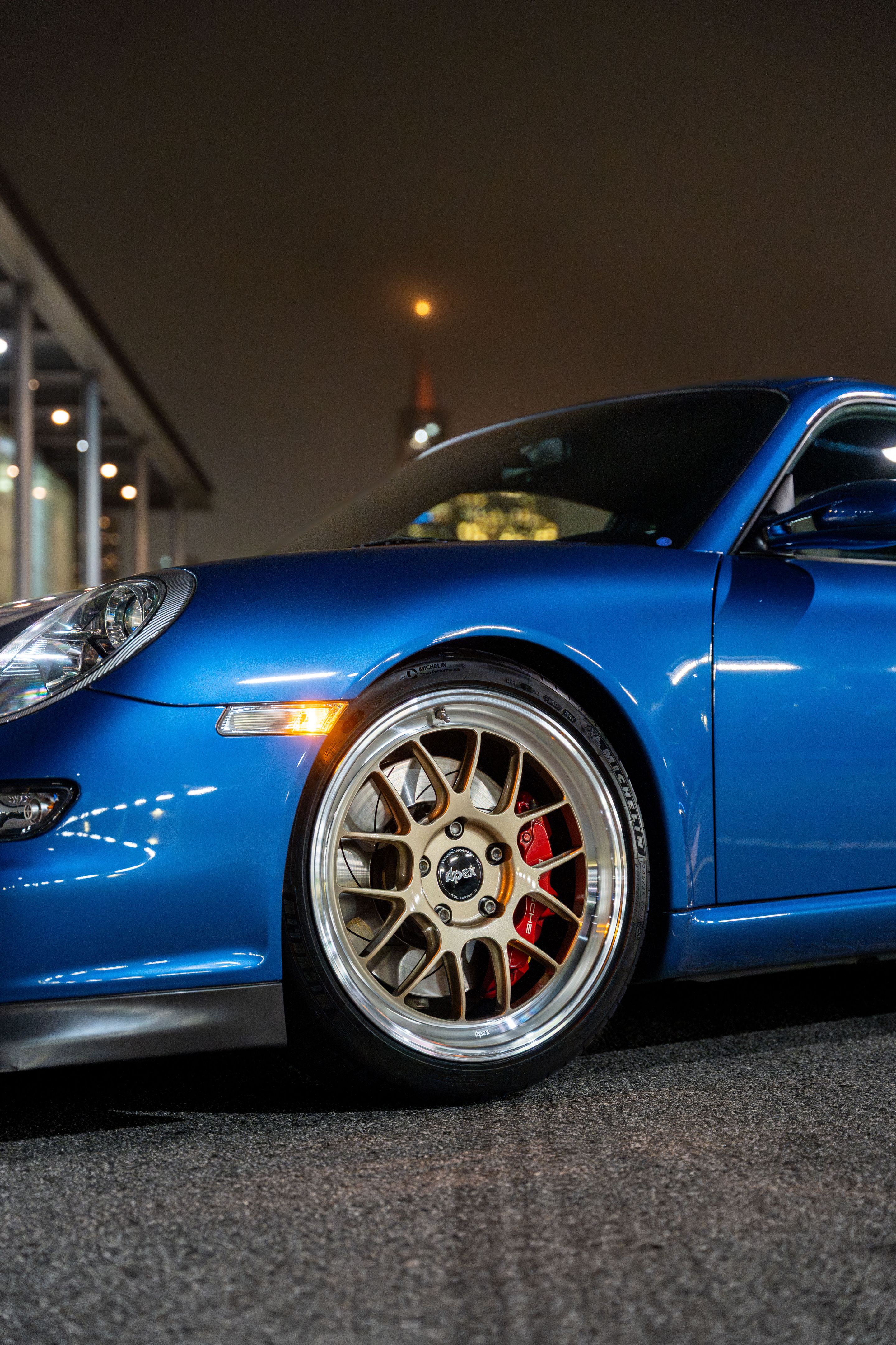 Blue Porsche 911 997 GT3 with 19" TEST-M Apex wheels in Machined Lip Gloss Motorsport Gold