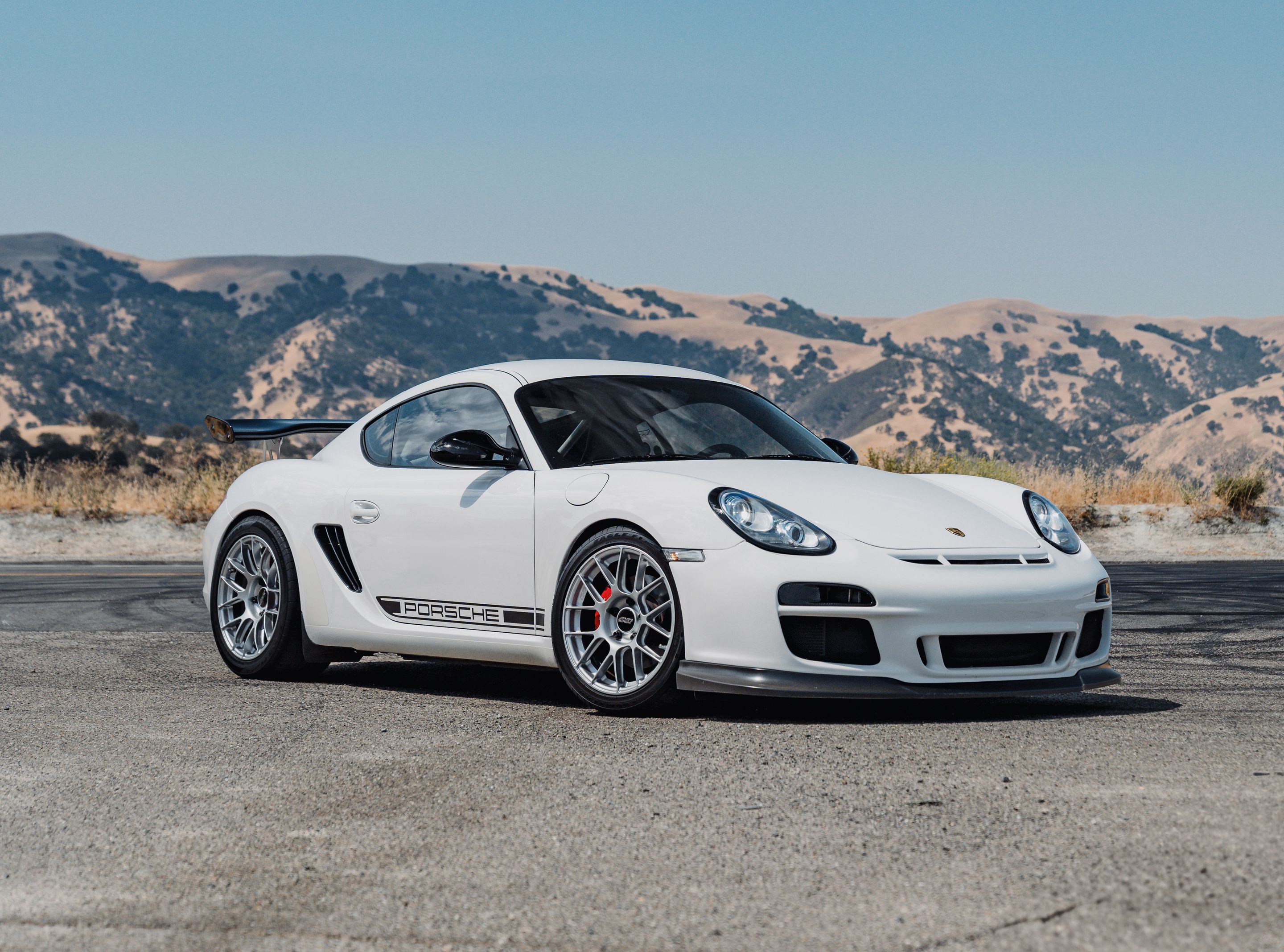 White Porsche 987 Cayman R with 18" EC-7RS Apex wheels in Race Silver