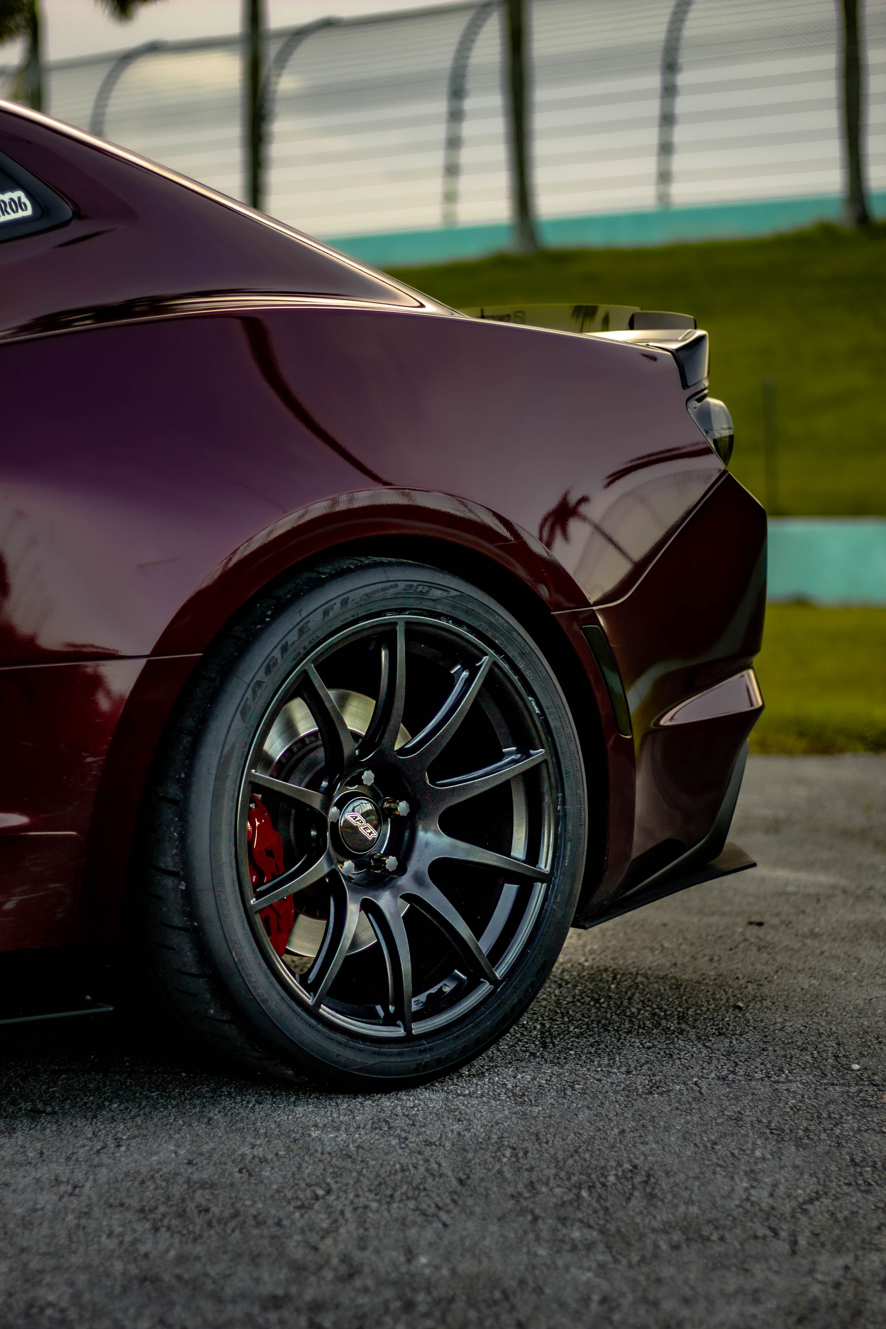 Red Chevrolet 6th Gen Camaro SS with 19" SM-10 Apex wheels in Satin Black