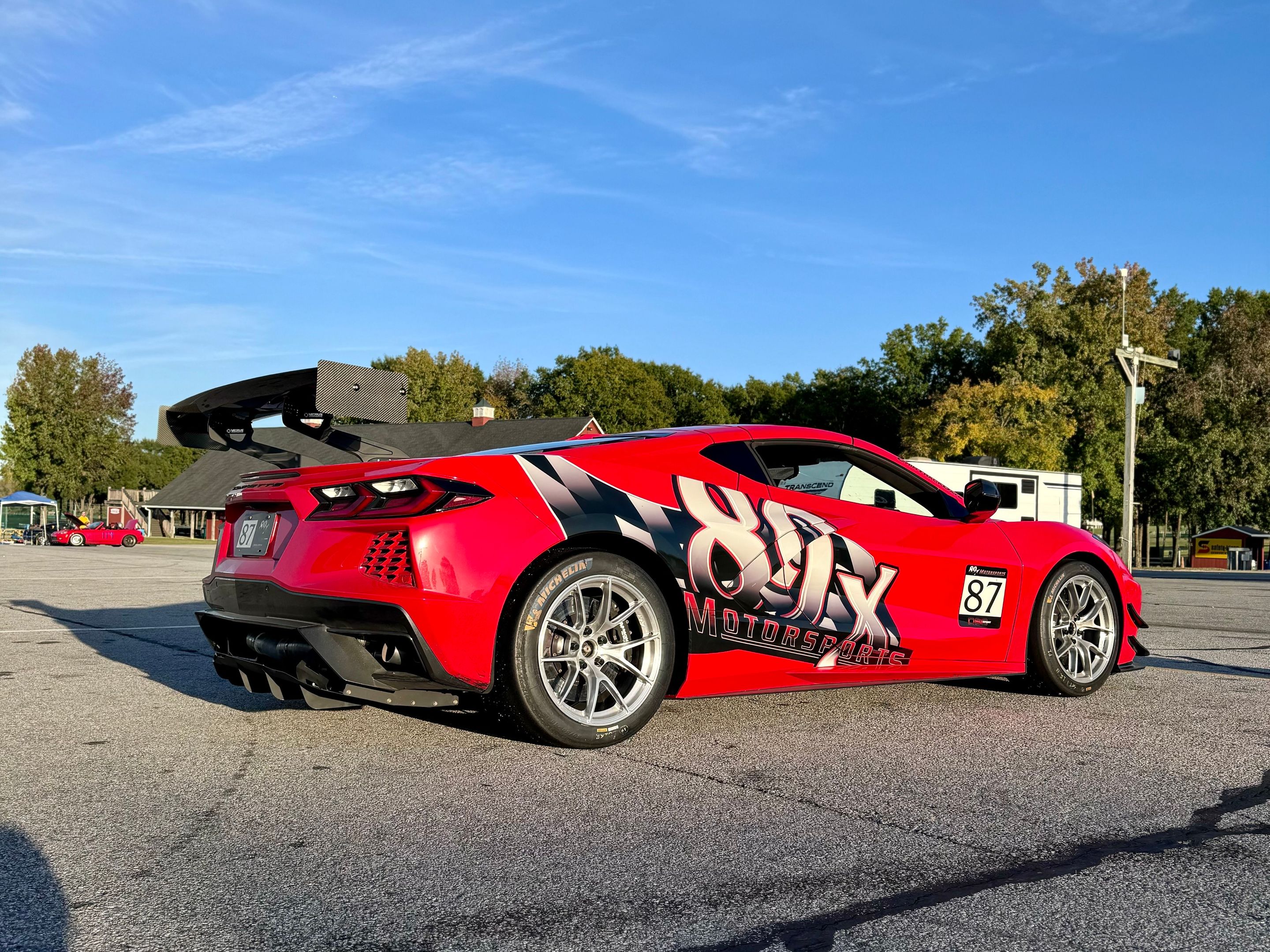 Red Chevrolet C8 Corvette Stingray/Z51 with 18" VS-5RS Apex wheels in Brushed Clear