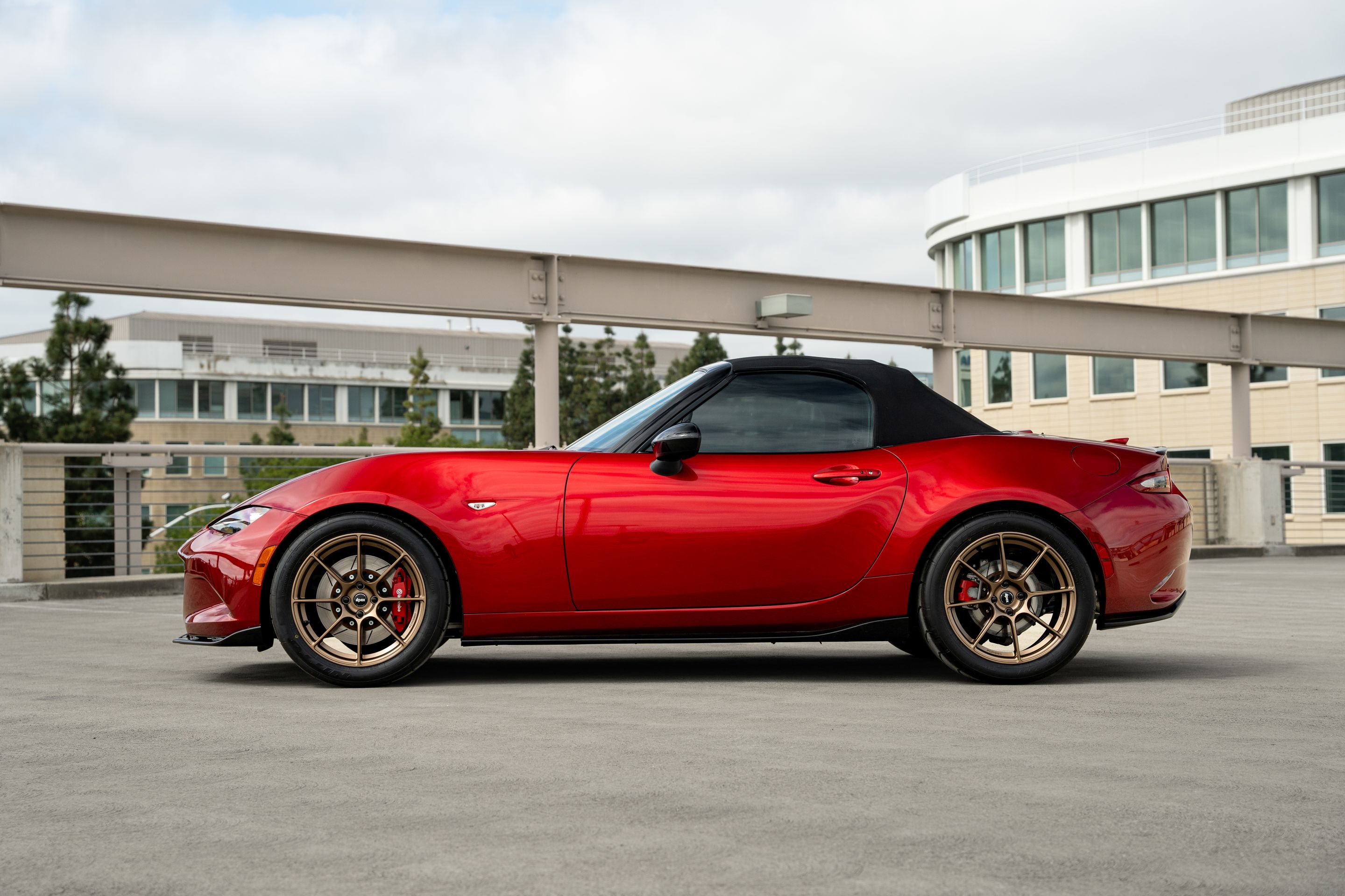 Red Mazda ND MX-5 Miata with 17" SM-8RS Apex wheels in Satin Bronze