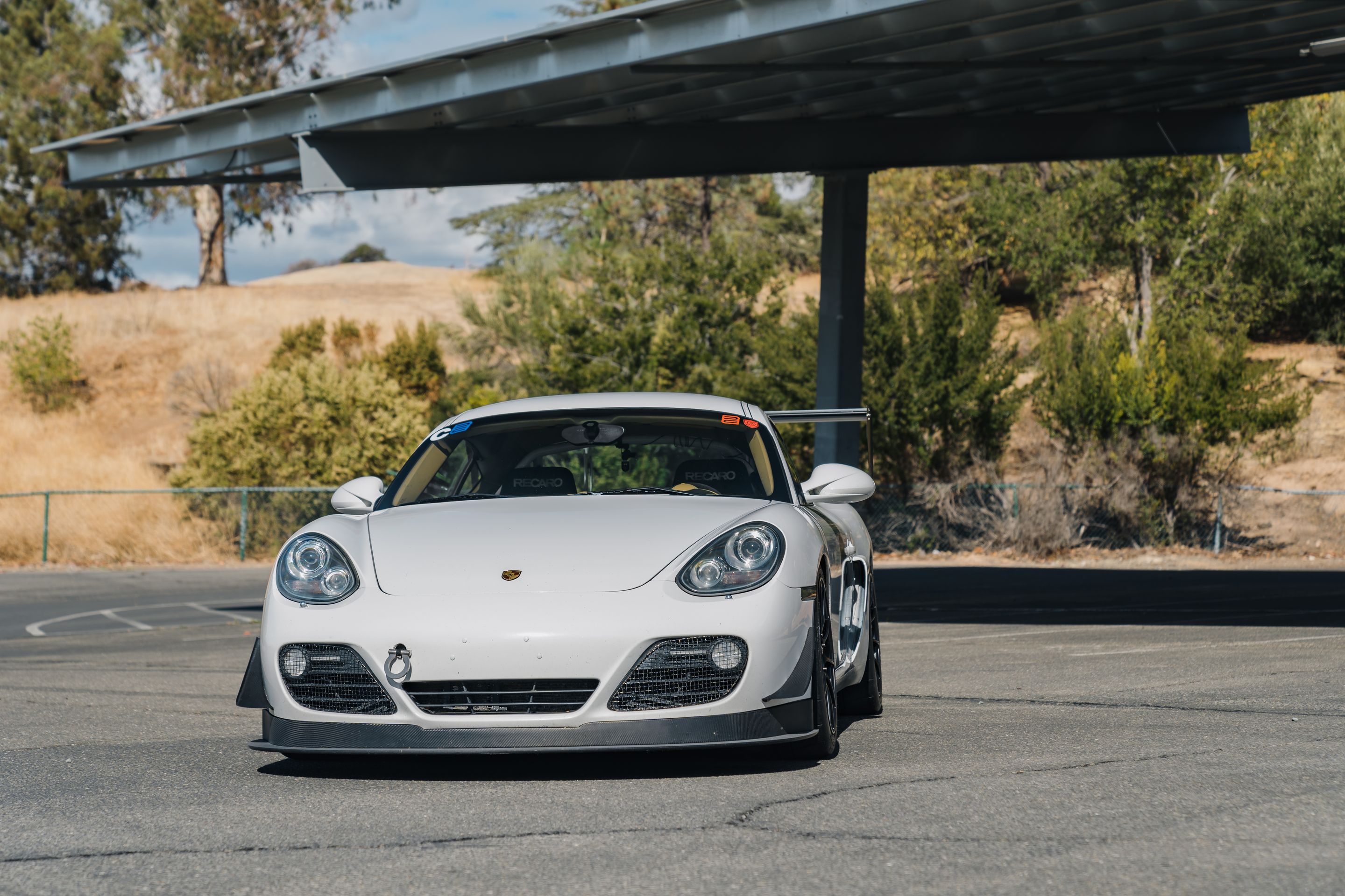 White Porsche 987 Cayman S with 18" SM-10RS Apex wheels in Satin Black