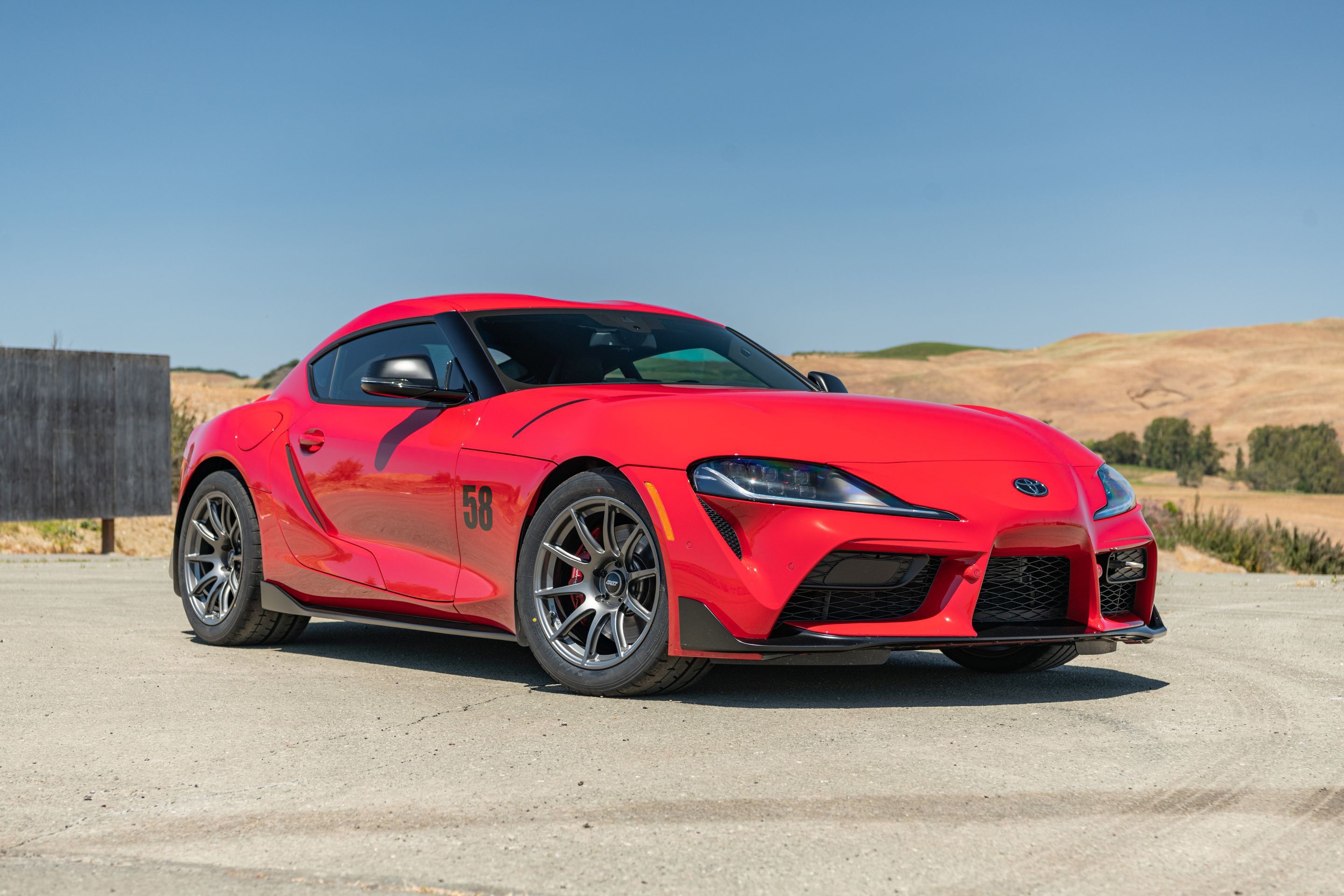 Red Toyota GR Supra with 18" SM-10 Apex wheels in Anthracite
