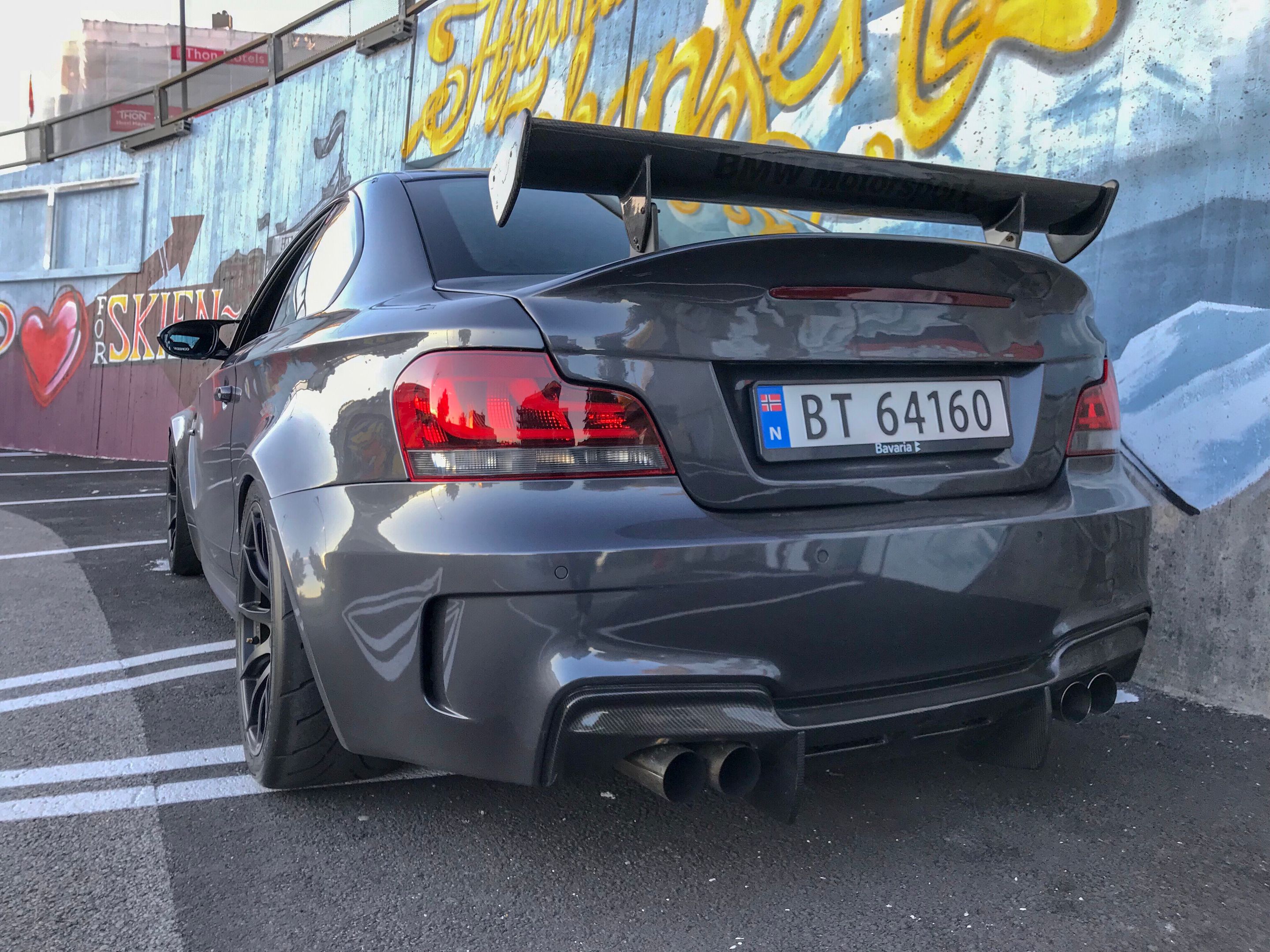 Grey BMW E82 1M with 18" SM-10 Apex wheels in Satin Black