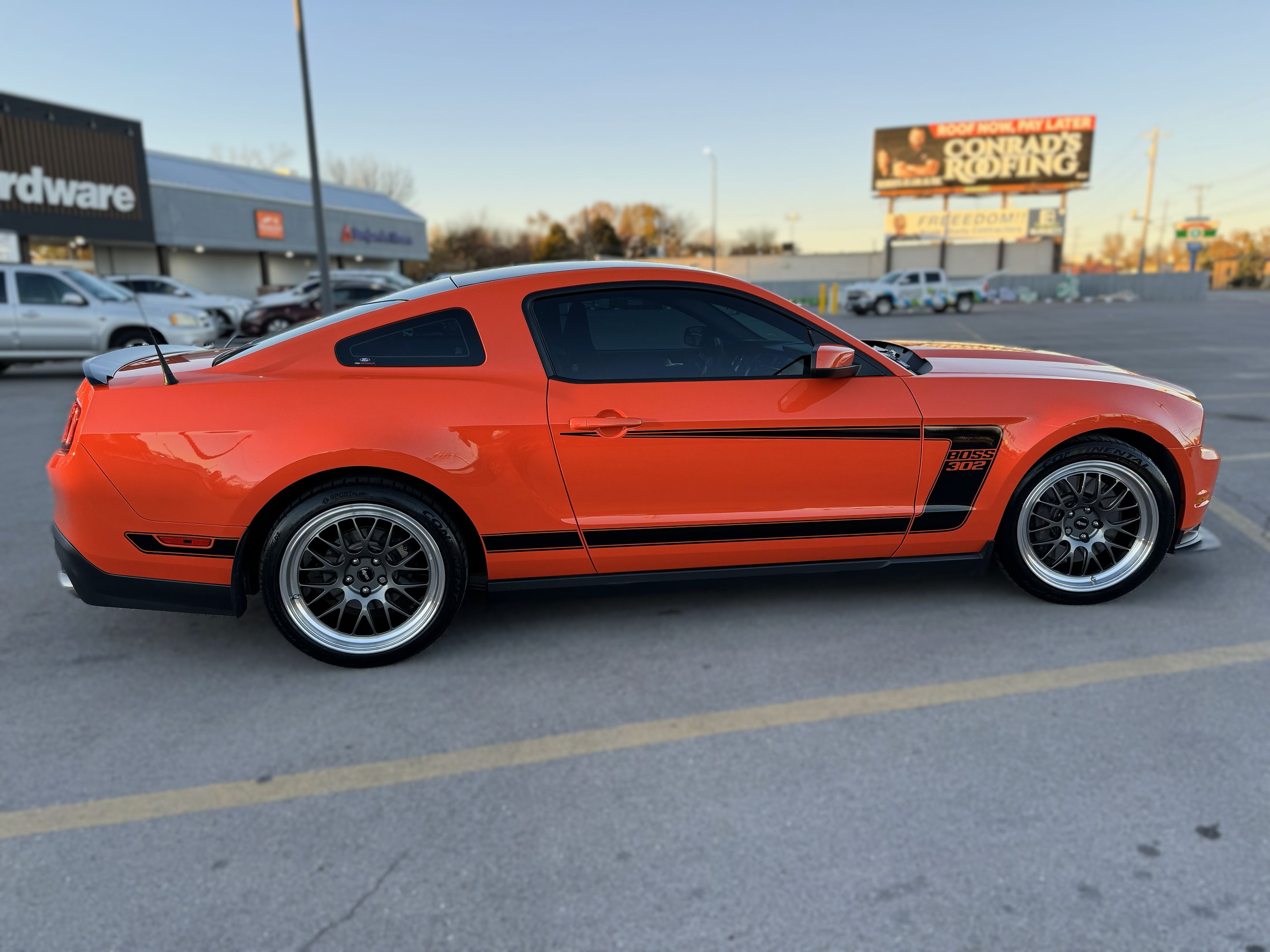 Orange Ford S197 Mustang Boss 302 with 19" ML-10RT Apex wheels in Machined Lip Anthracite