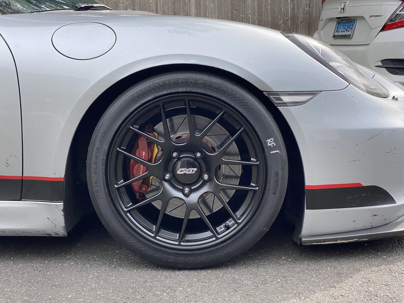 Silver Porsche 981 Cayman S with 18" EC-7R Apex wheels in Satin Black