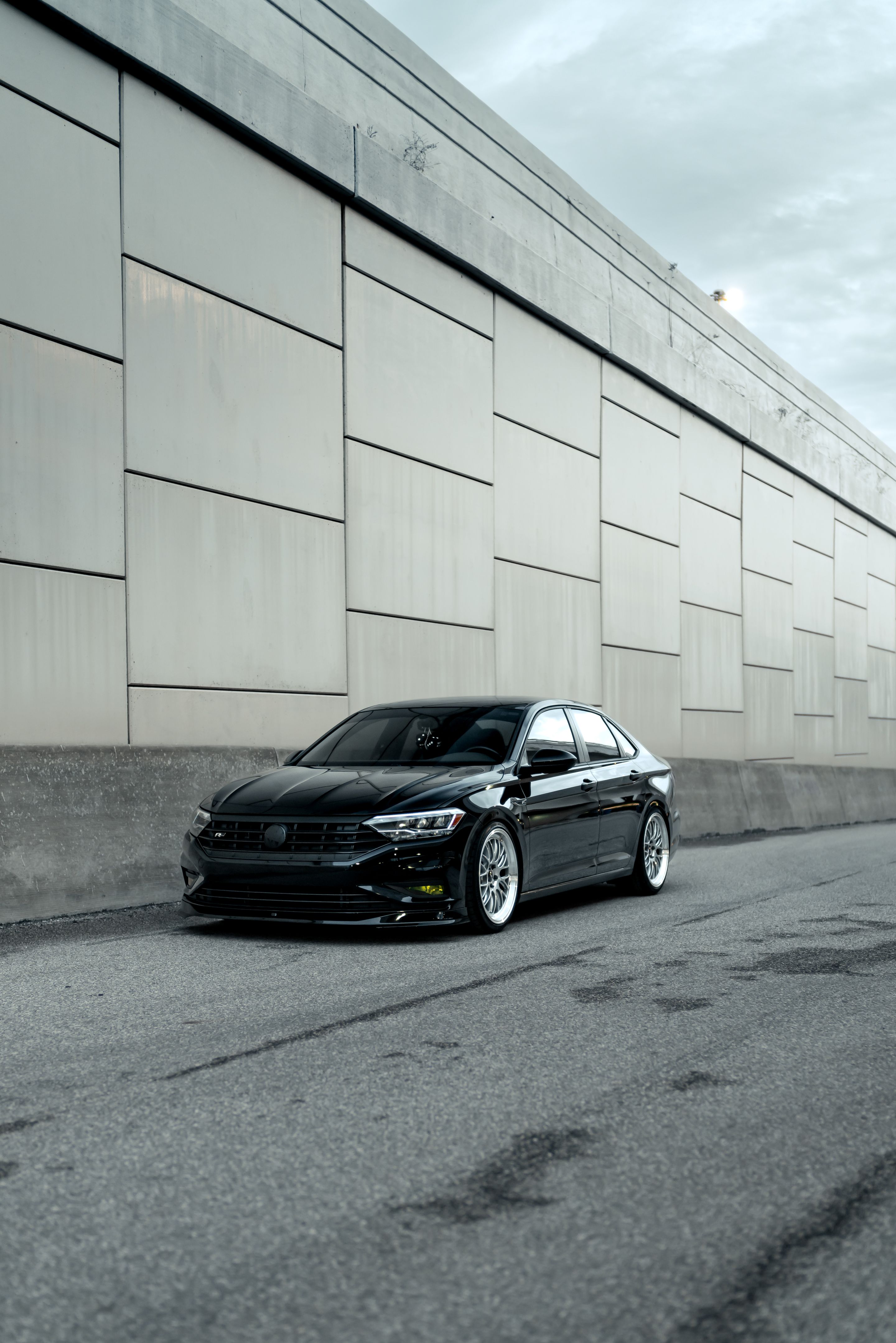 Black VW MK7 Jetta with 19" ML-10RT Apex wheels in Machined Lip Race Silver