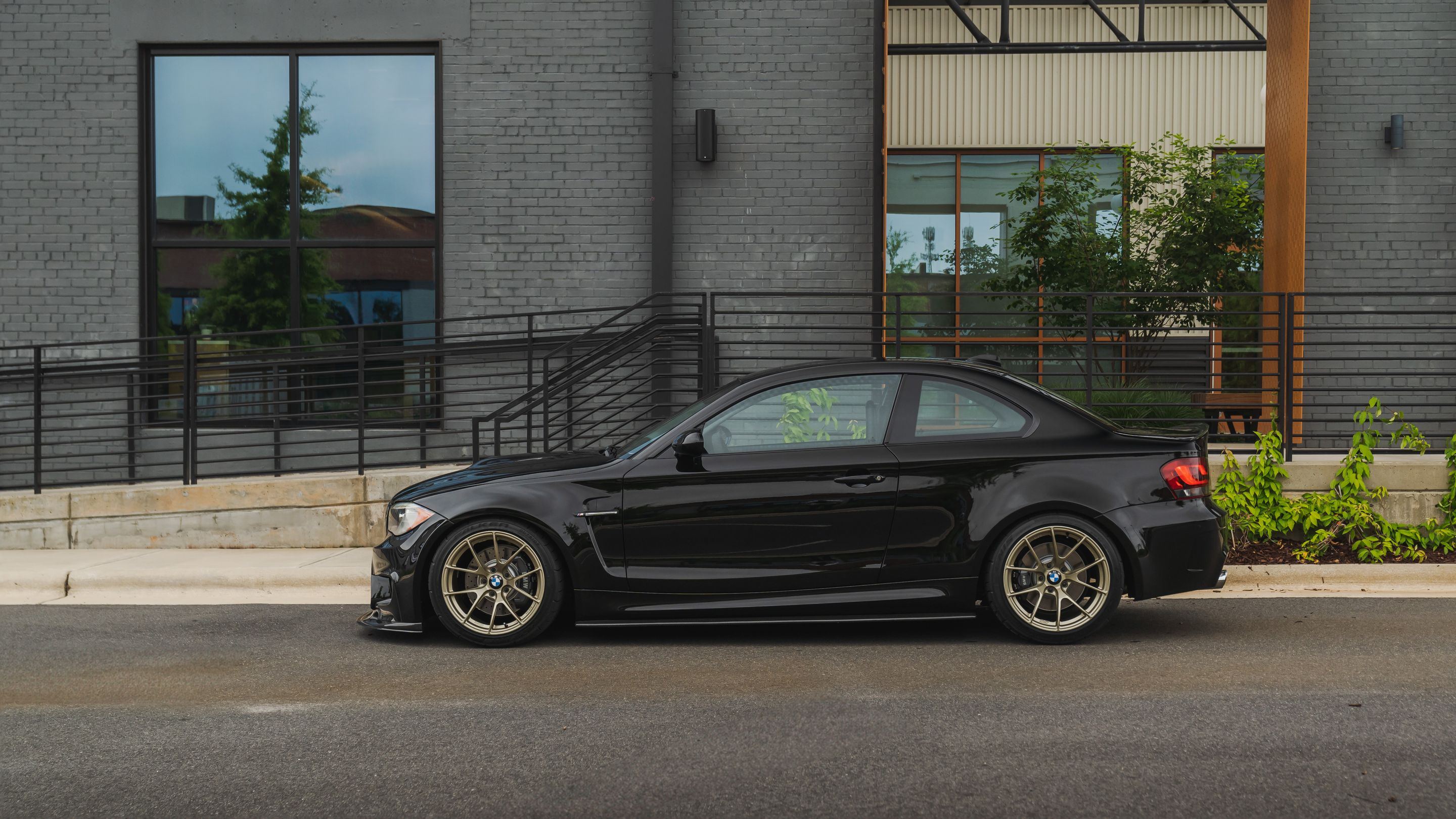 Black BMW E82 Coupe 1 Series with 18" VS-5RS Apex wheels in Motorsport Gold