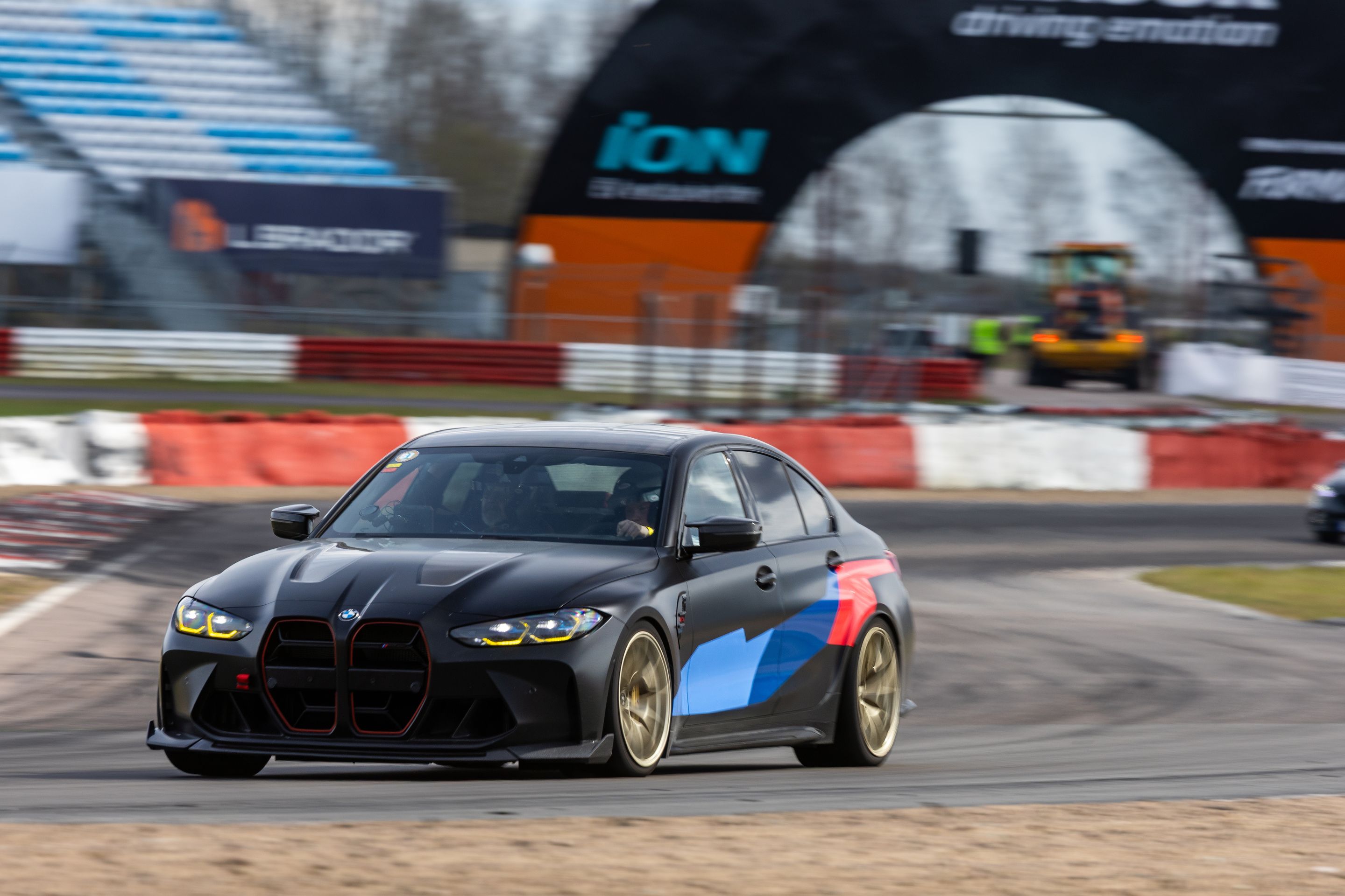 Black BMW G80 M3 with 19" VS-5RS Apex wheels in Motorsport Gold