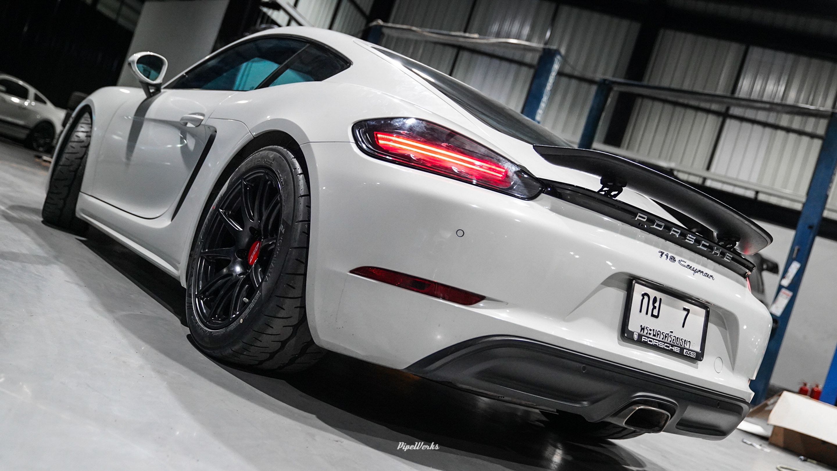 White Porsche 718 Cayman Base with 18" SM-10 Apex wheels in Satin Black