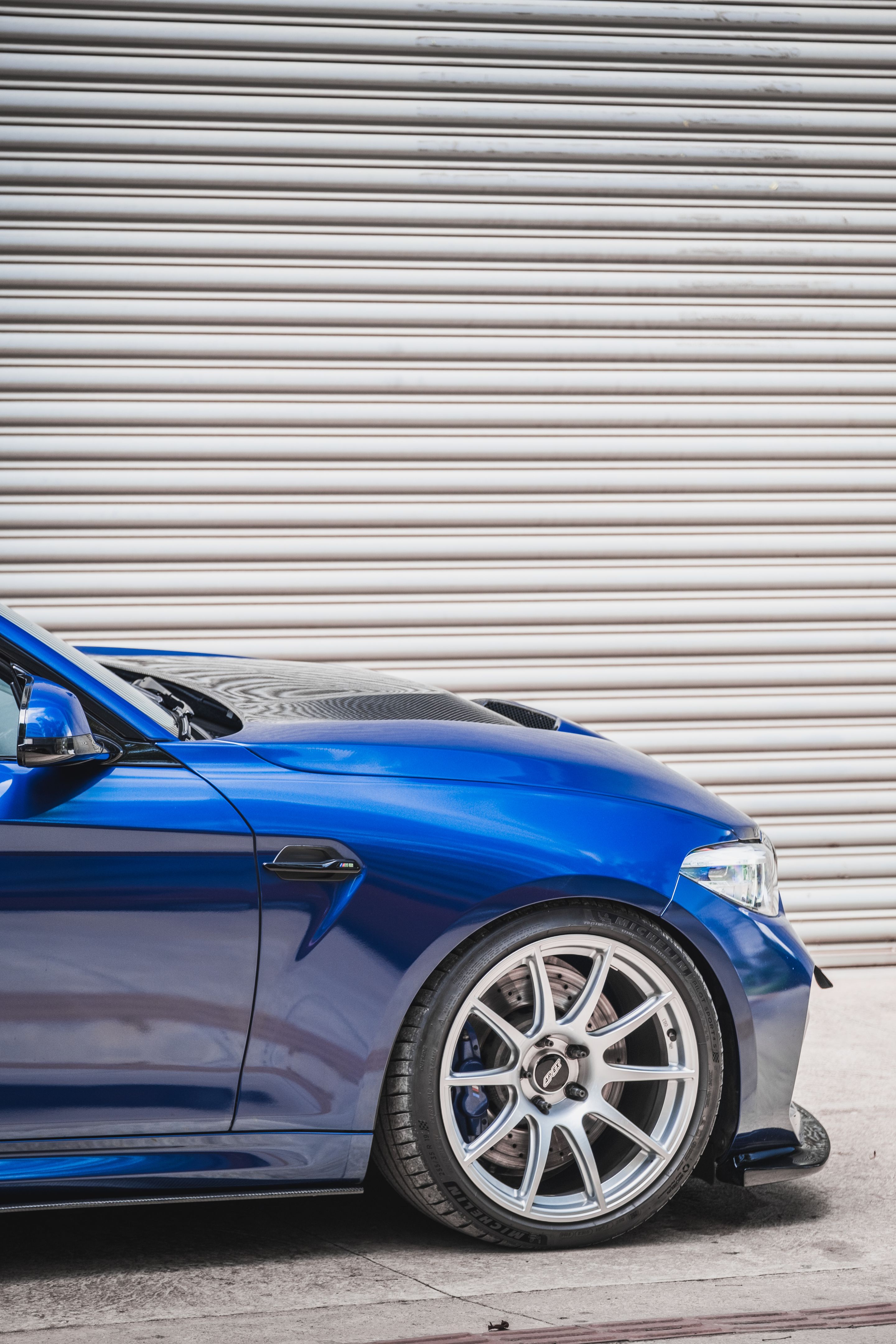 Blue BMW F87 M2 with 19" SM-10 Apex wheels in Race Silver