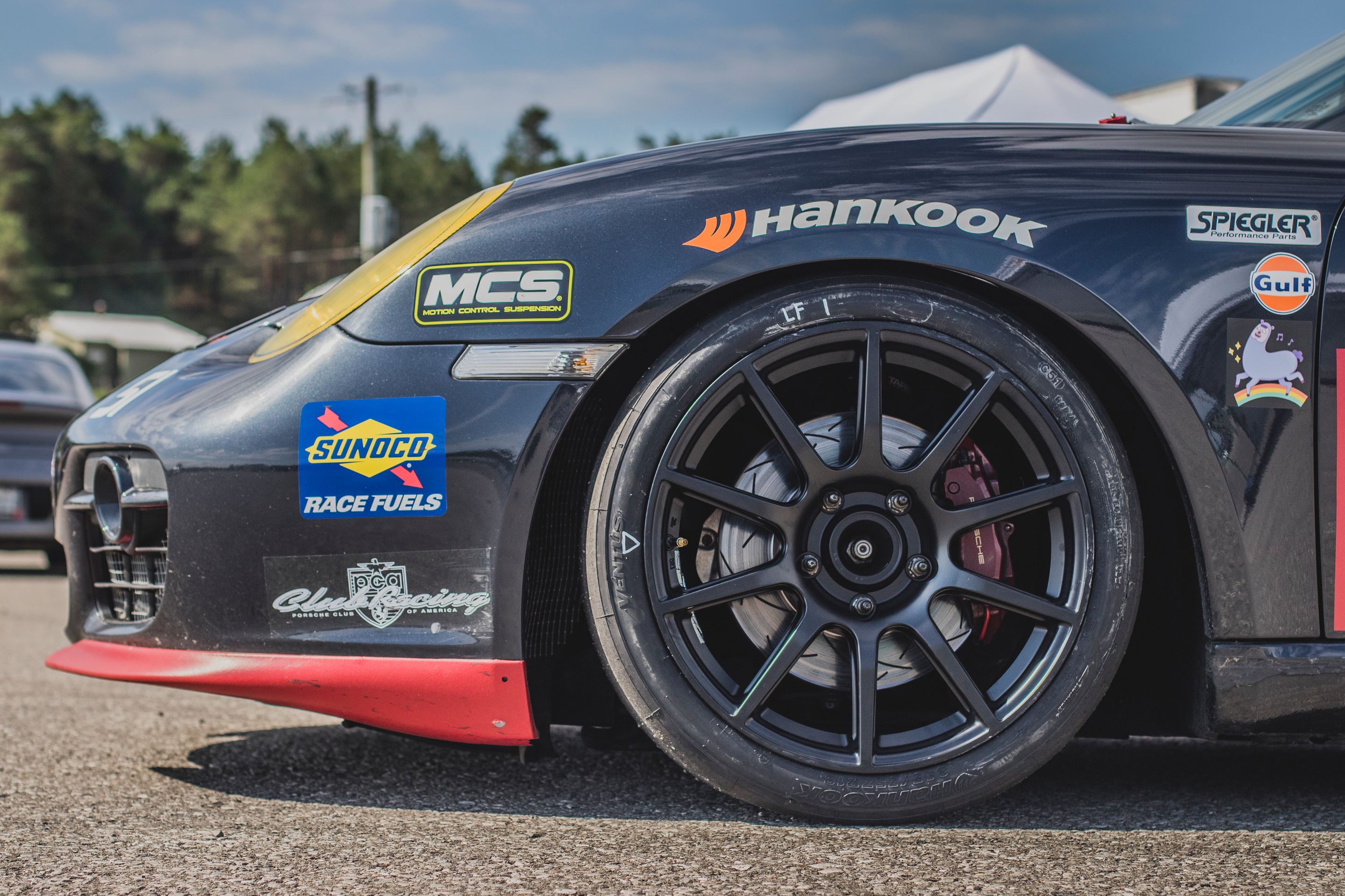 Black Porsche 987 Spec Cayman (SPC) with 18" SM-10 Apex wheels in Satin Black