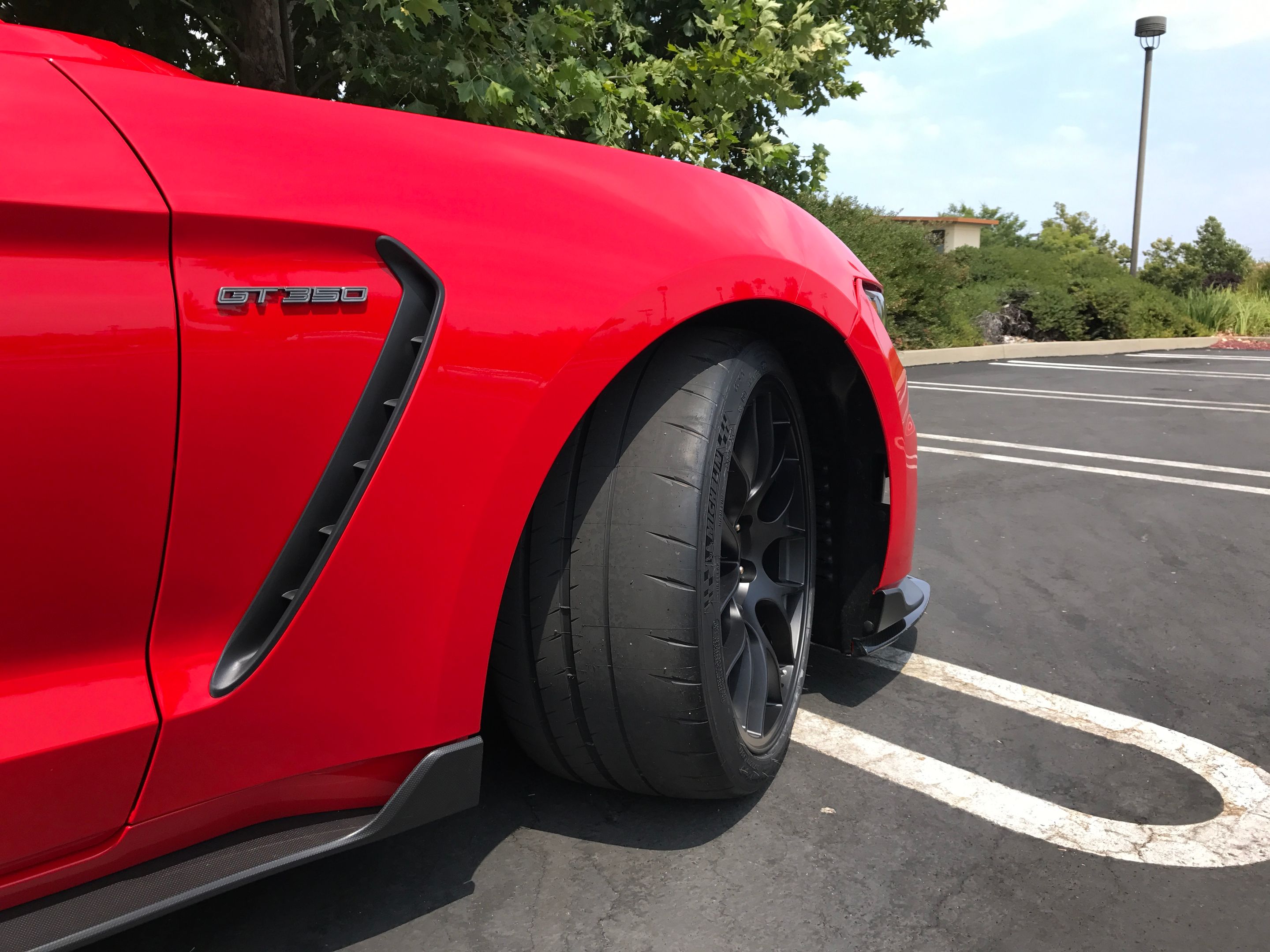 Red Ford S550 Mustang GT350 with 19" EC-7 Apex wheels in Satin Black