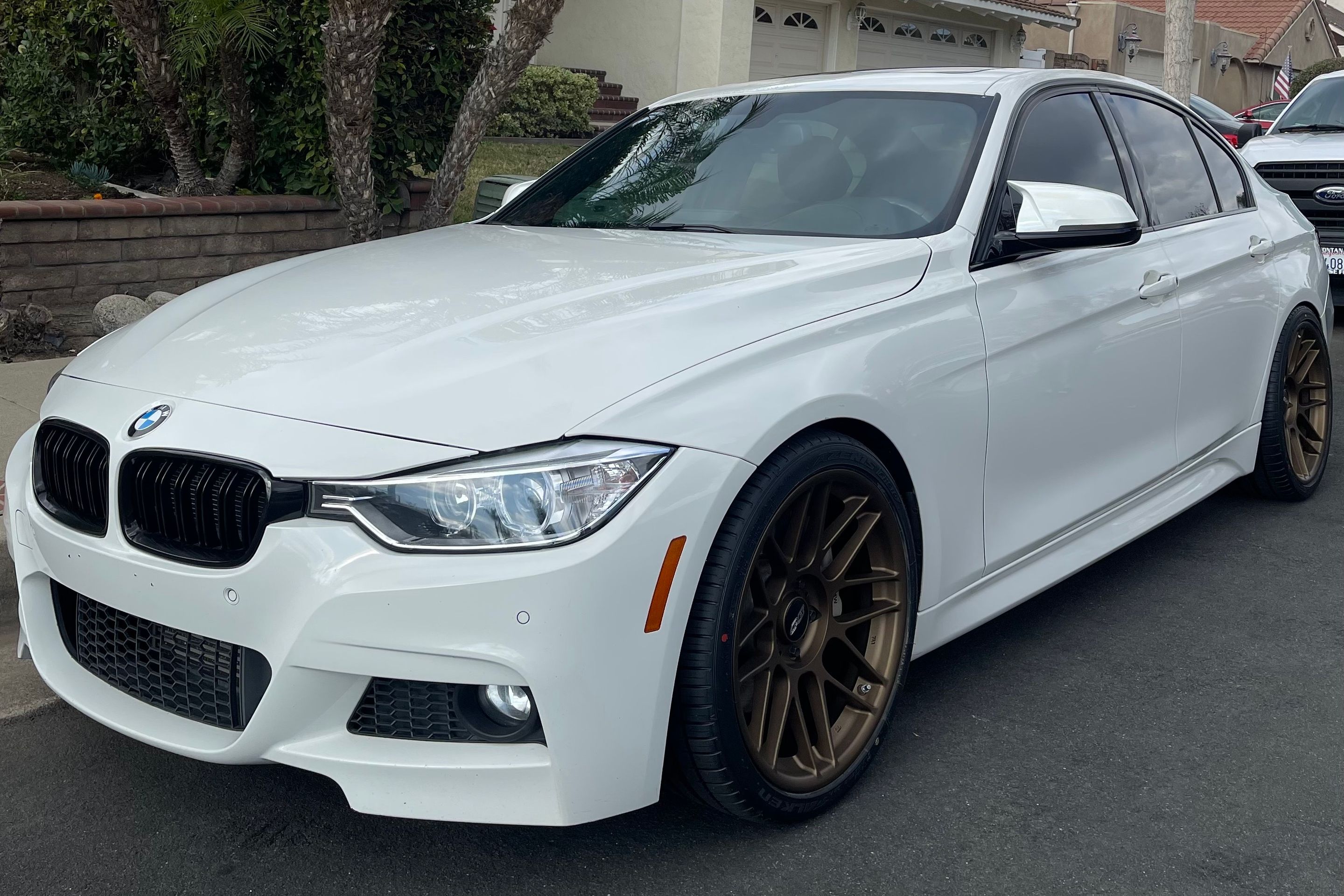 White BMW F30 Sedan 3 Series with 19" ARC-8 Apex wheels in Satin Bronze
