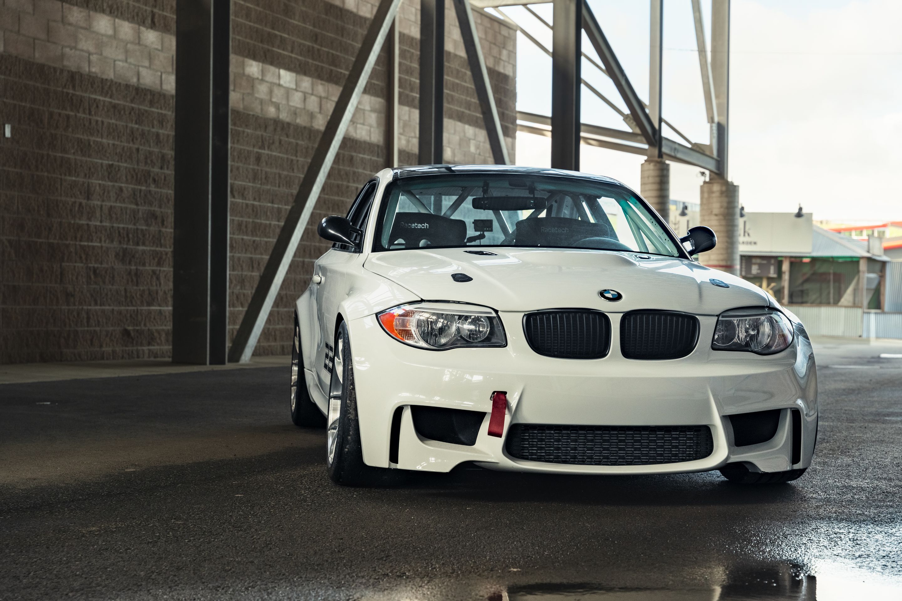 White BMW E82 1M with 18" VS-5RS Apex wheels in Brushed Clear