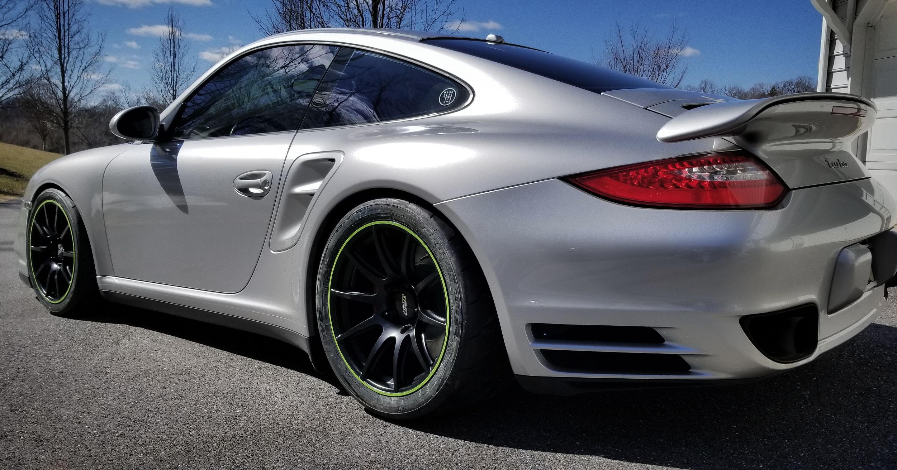 Silver Porsche 911 997 Turbo with 18" SM-10 Apex wheels in Satin Black