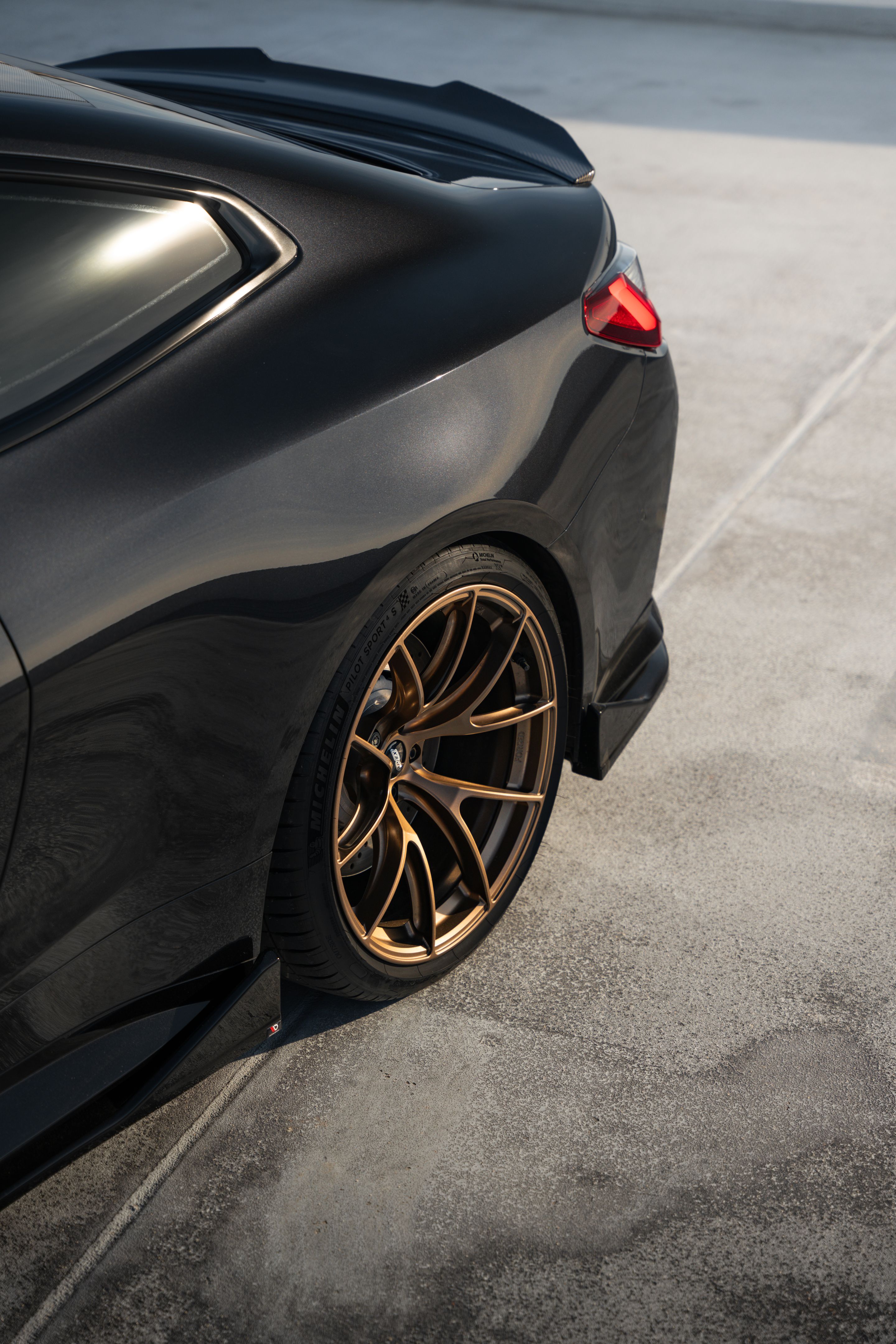 Black BMW G82 Coupe M4 with 20" VS-5RS Apex wheels in Satin Bronze