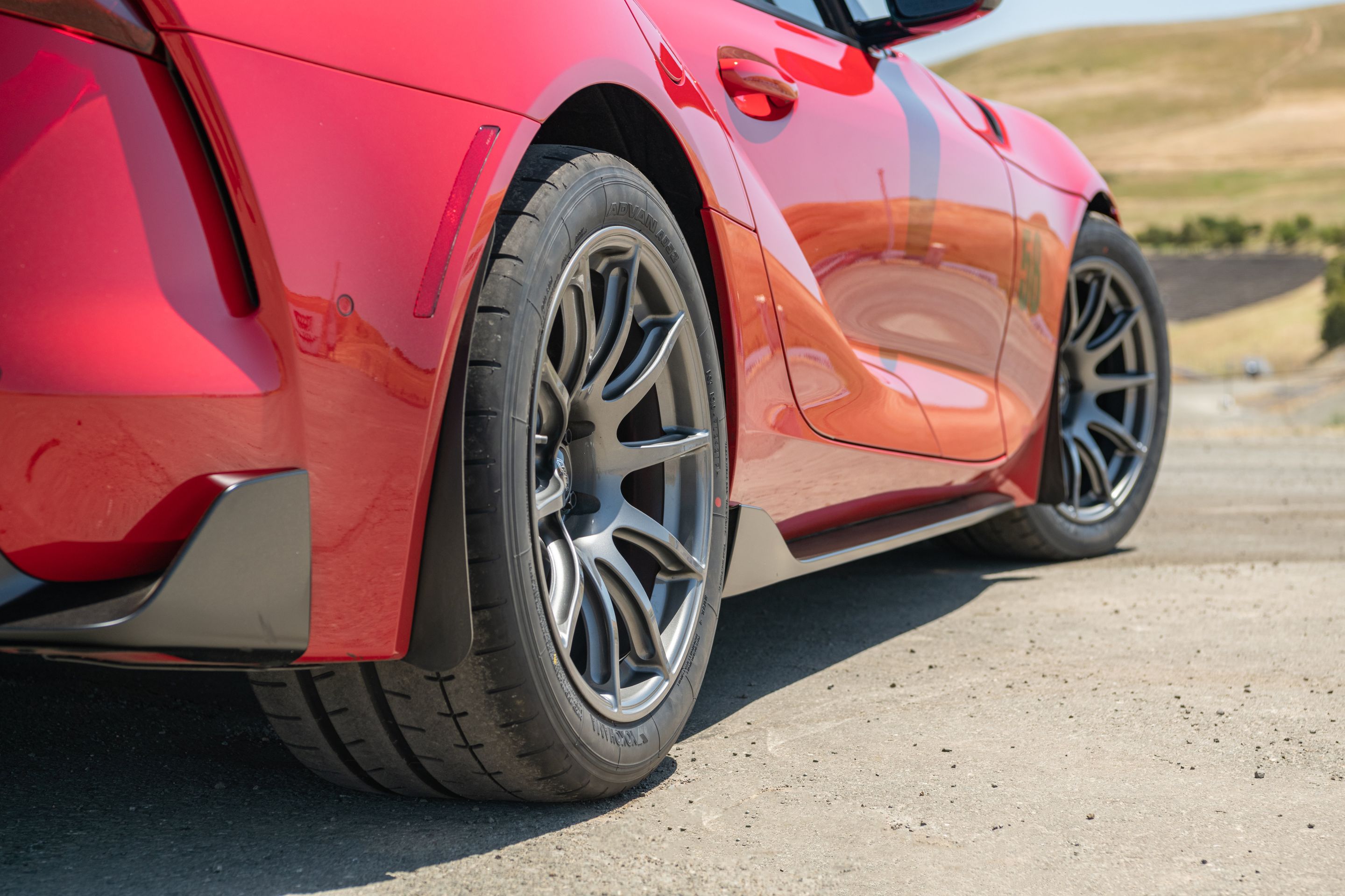 Red Toyota GR Supra with 18" SM-10 Apex wheels in Anthracite