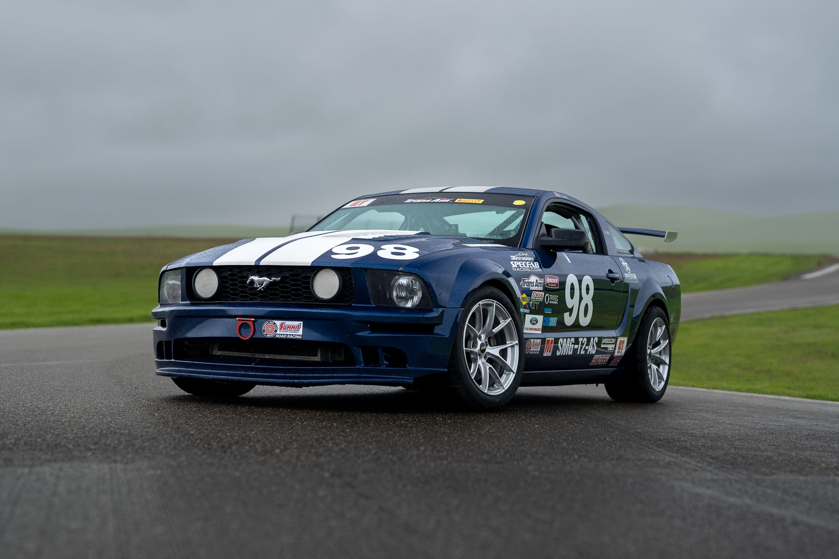 Blue Ford S197 Mustang GT with 18" VS-5RS Apex wheels in Brushed Clear