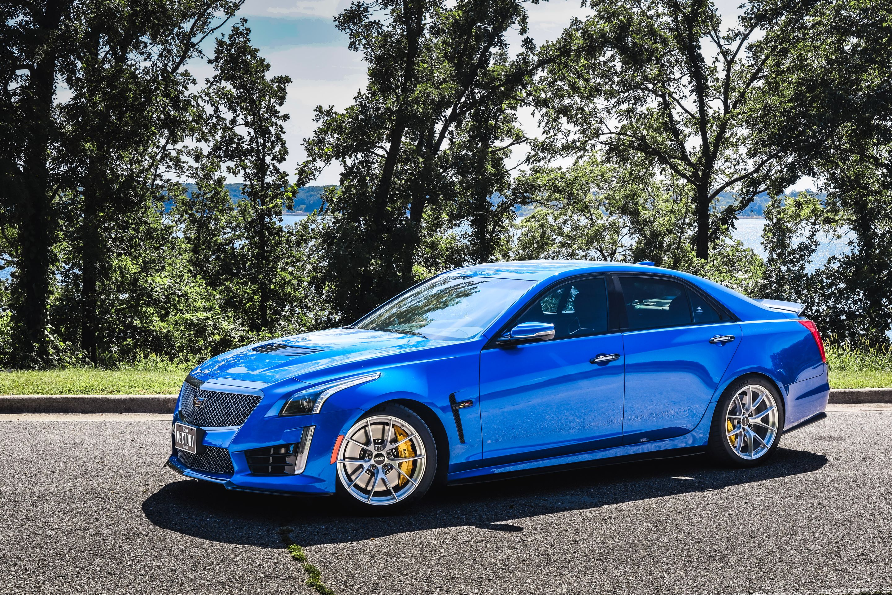 Blue Cadillac Gen 3 CTS-V with 19" VS-5RS Apex wheels in Brushed Clear