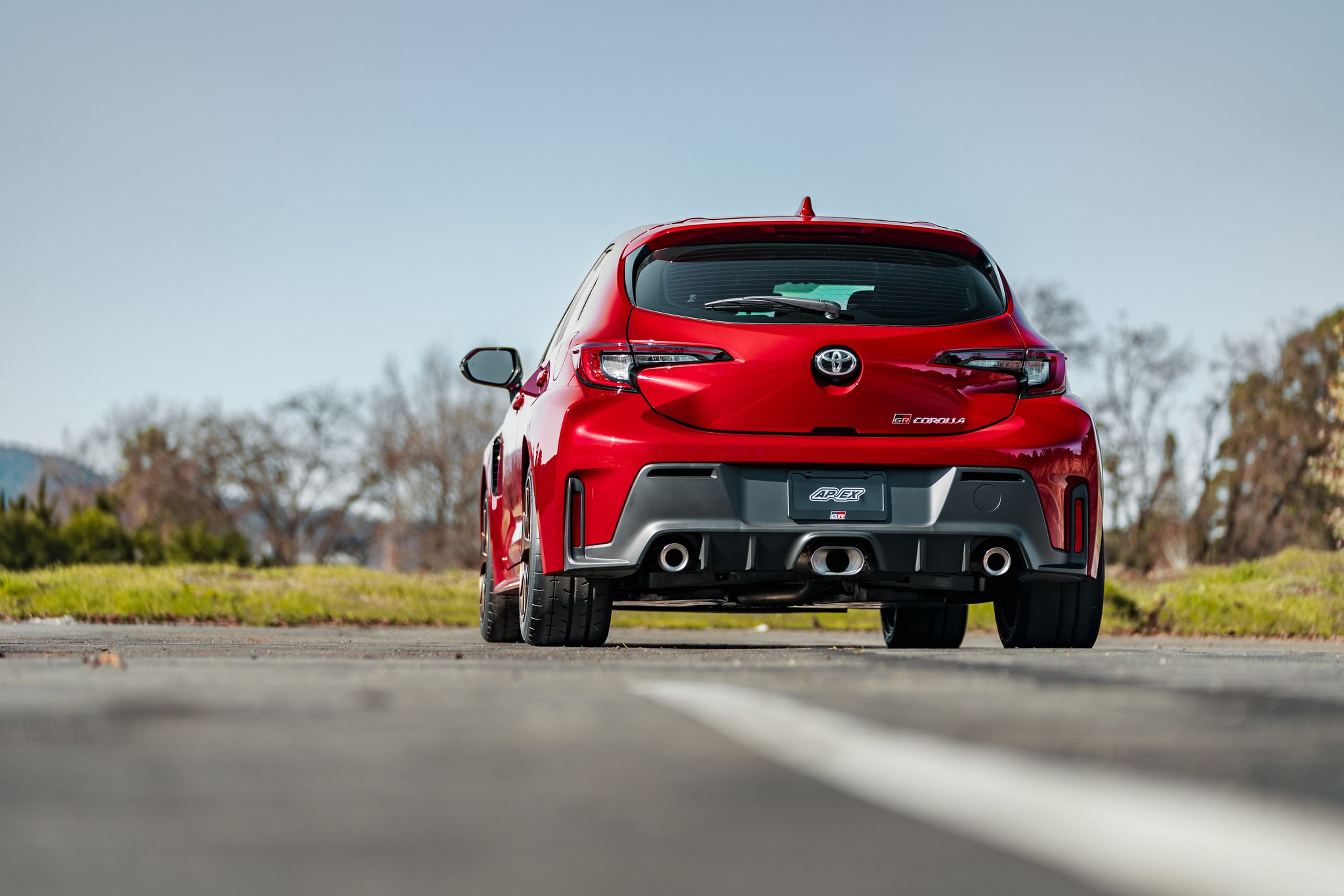 Red Toyota GR Corolla with 17" VS-5RS Apex wheels in Satin Bronze