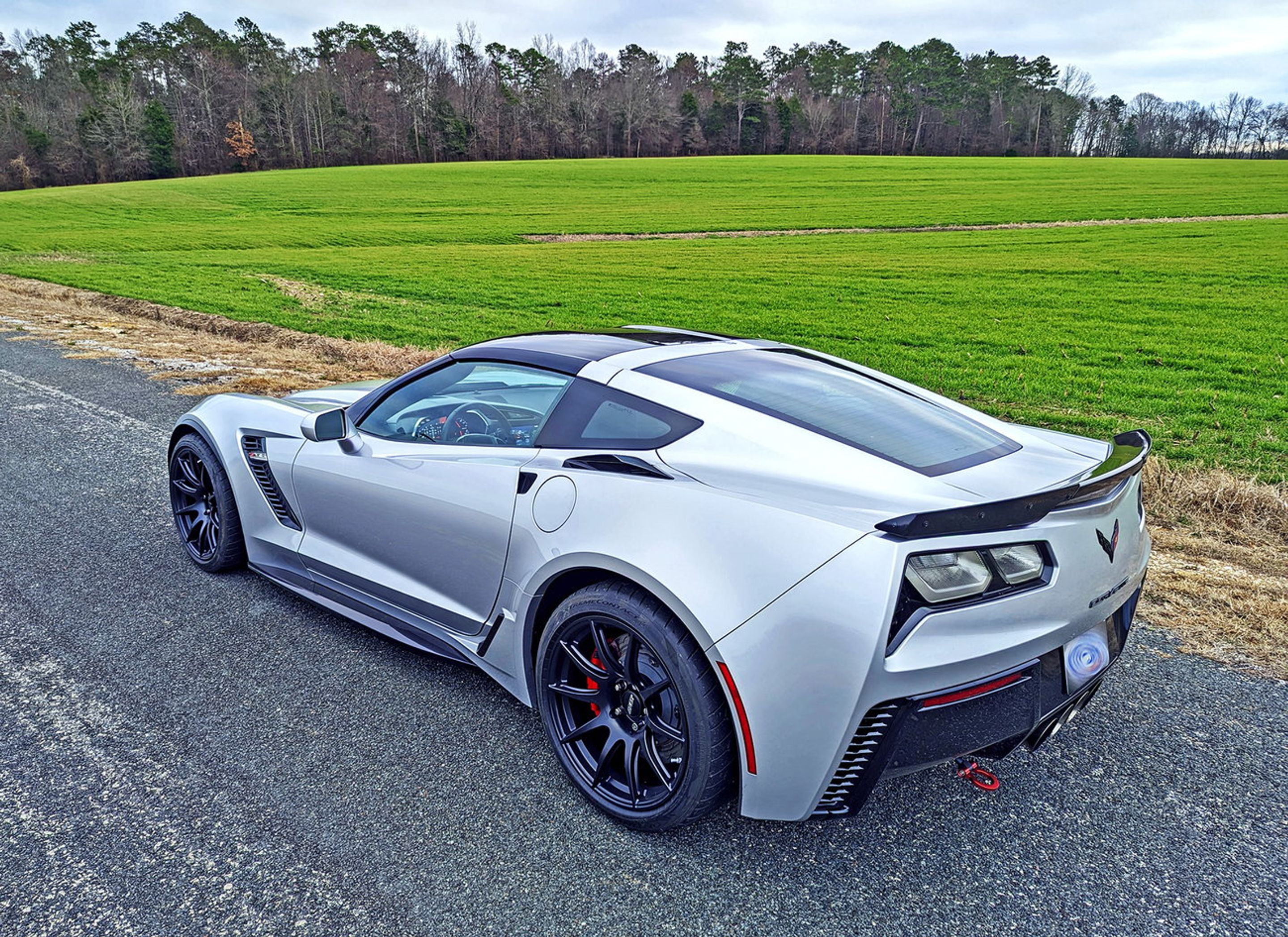 Silver Chevrolet C7 Corvette Z06 with 19" SM-10 Apex wheels in Satin Black