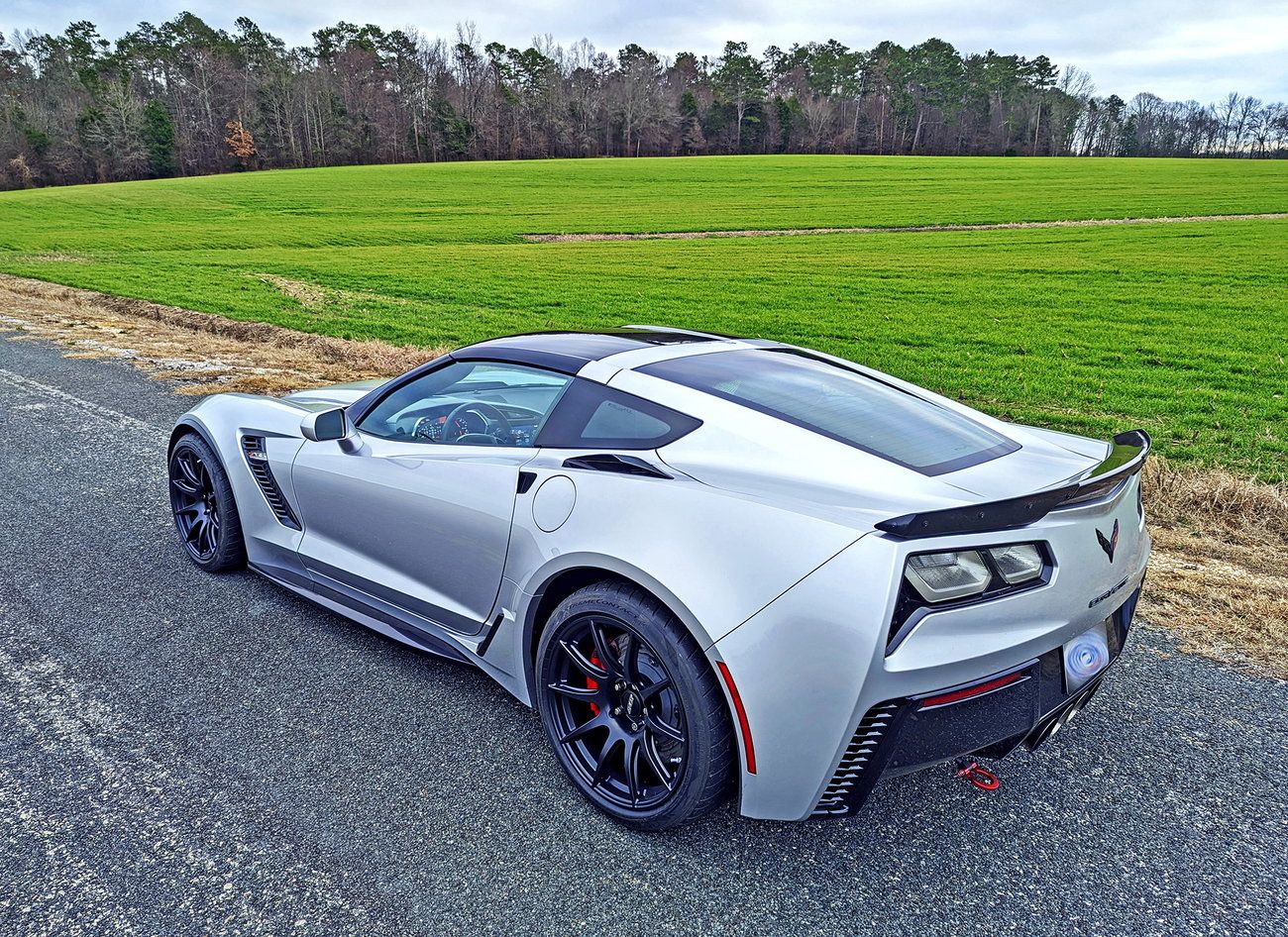 Silver Chevrolet C7 Corvette Z06 with 19" SM-10 Apex wheels in Satin Black