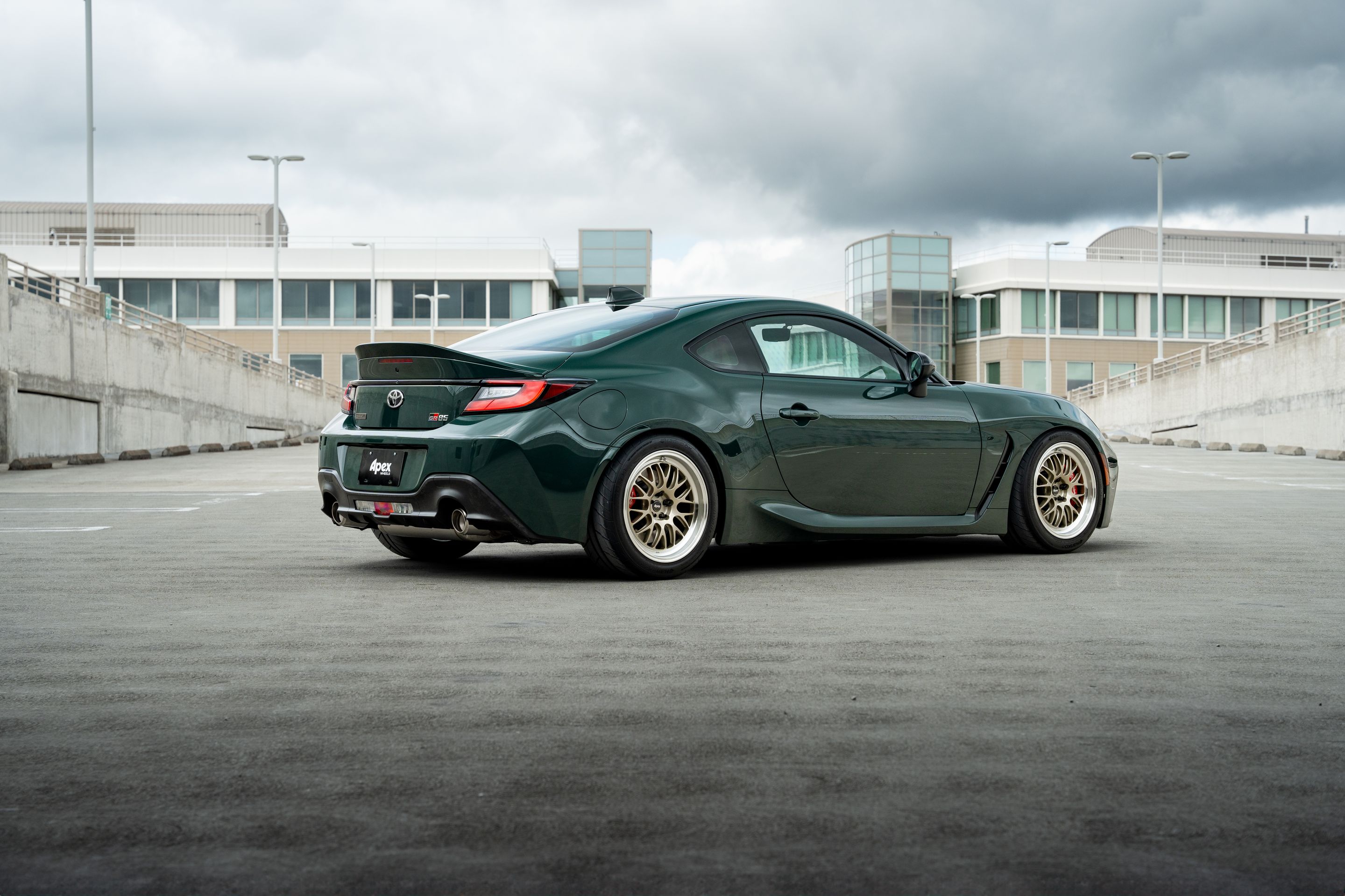Green Toyota GR86 with 17" ML-10RT Apex wheels in Machined Lip Gloss Motorsport Gold