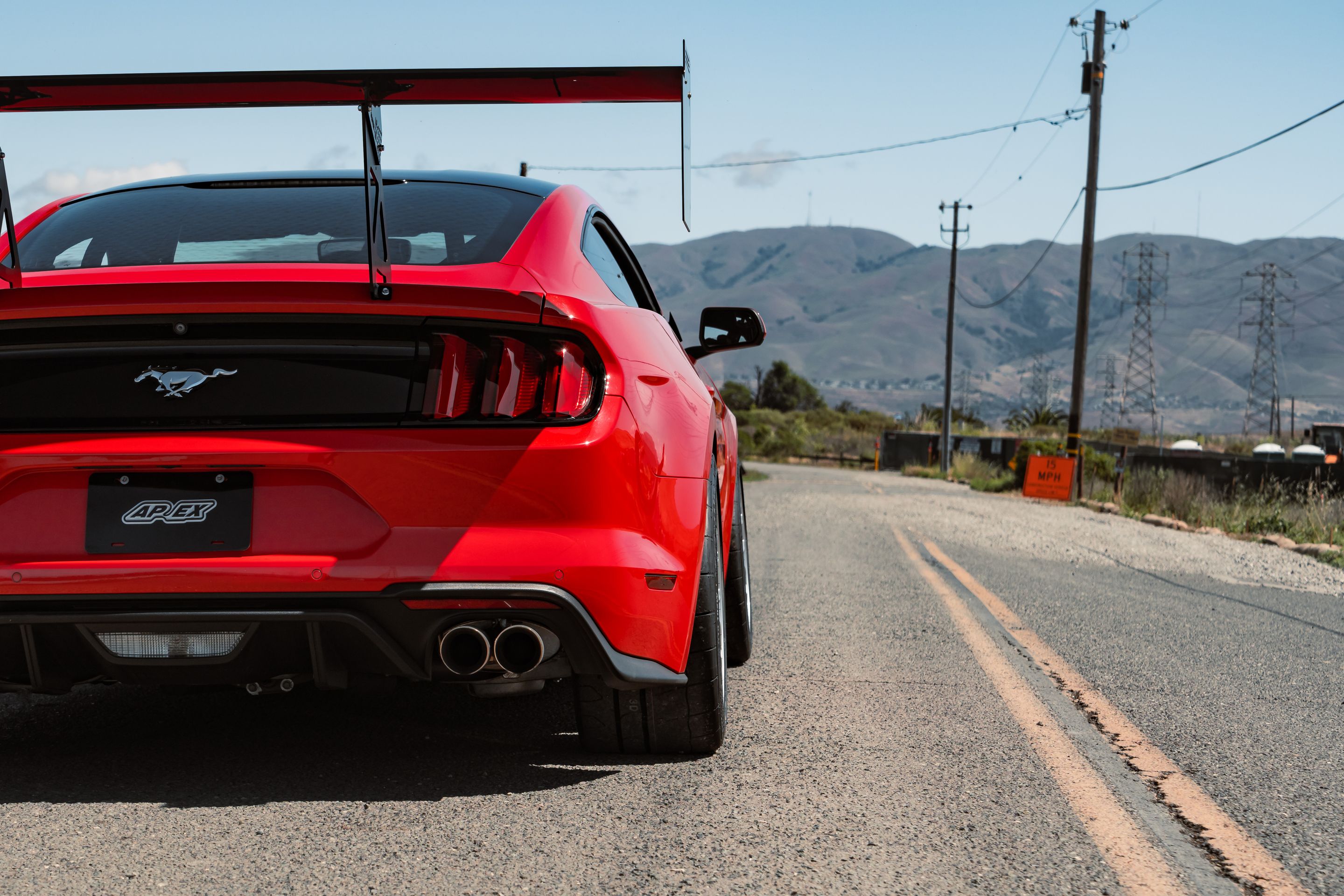 Red Ford S550 Mustang GT with 19" EC-7 Apex wheels in Race Silver