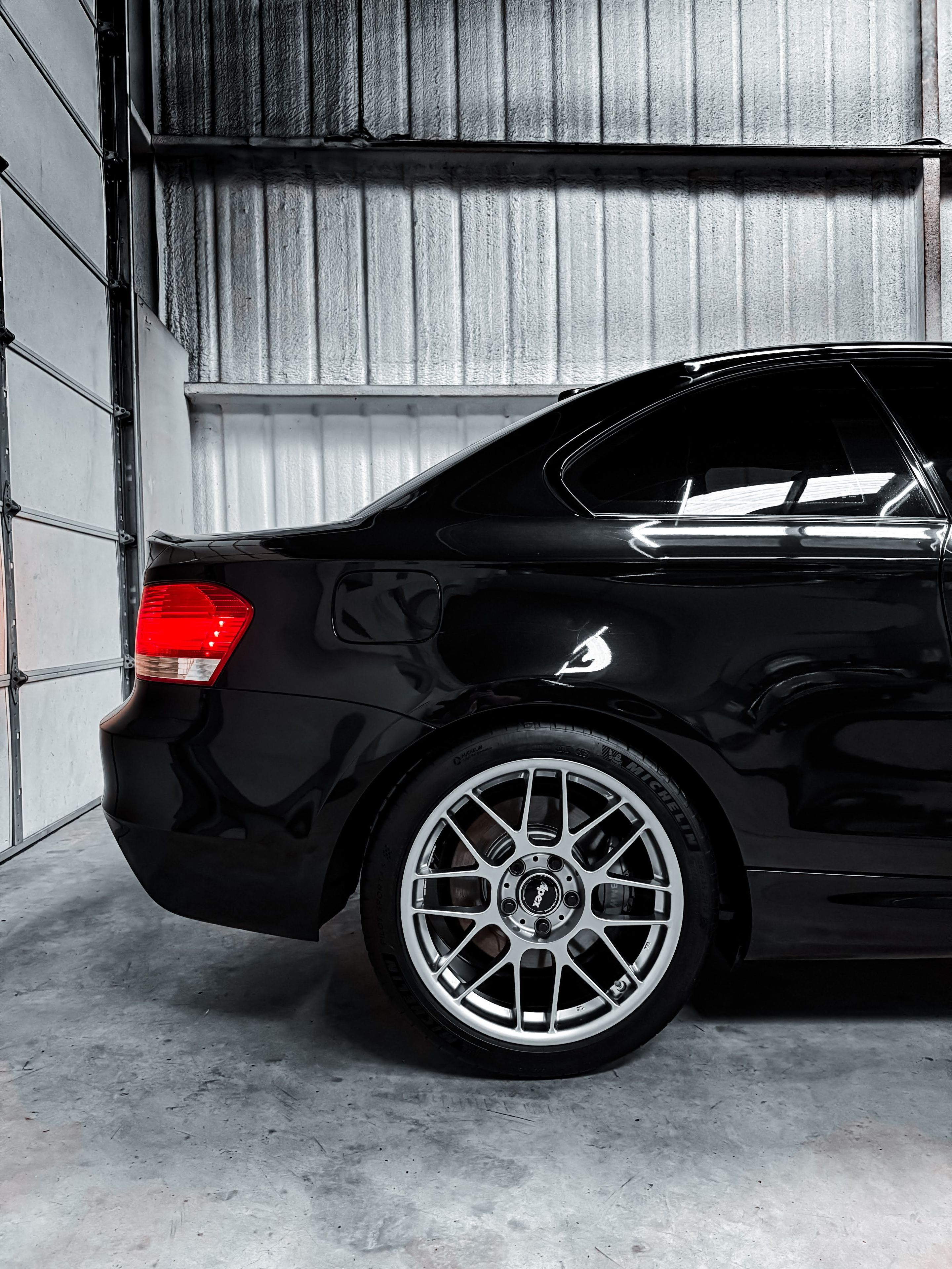 Black BMW E82 Coupe 1 Series with 18" ARC-8 Apex wheels in Hyper Black