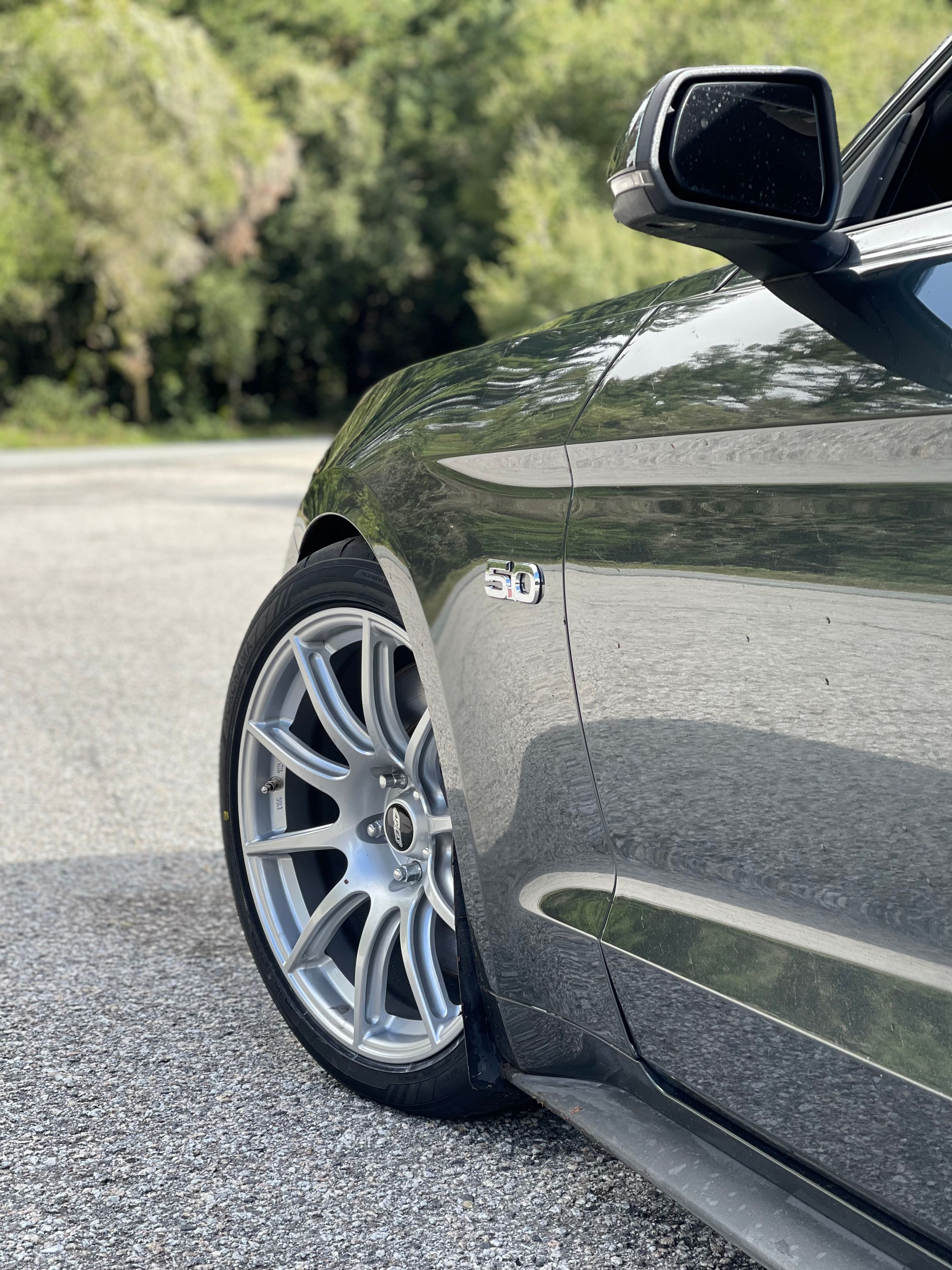 Green Ford S550 Mustang GT with 19" SM-10 Apex wheels in Race Silver