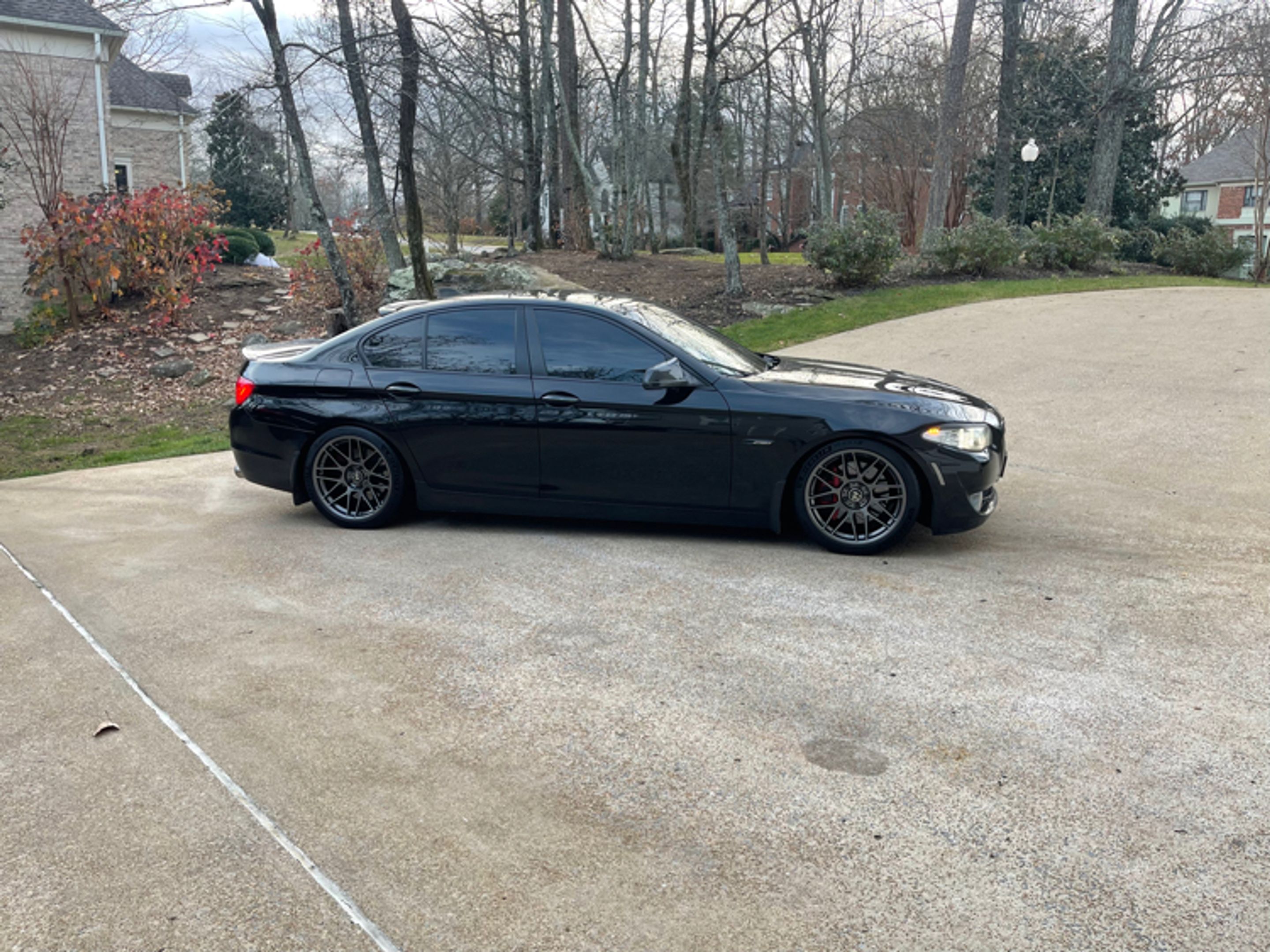 Black BMW F10 Sedan 5 Series with 19" ARC-8 Apex wheels in Anthracite