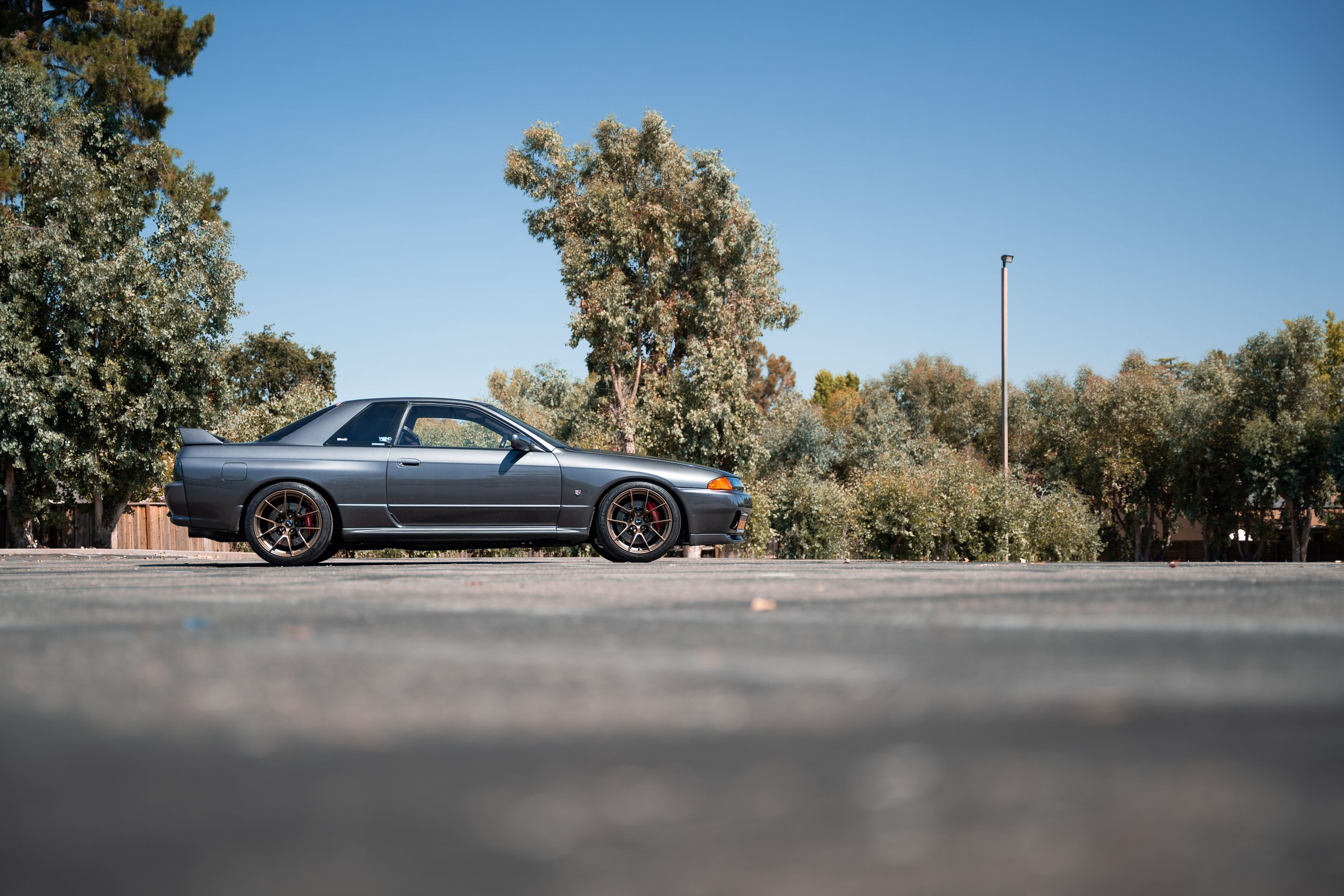 Grey Nissan R32 GT-R with 18" VS-5RS Apex wheels in Satin Bronze